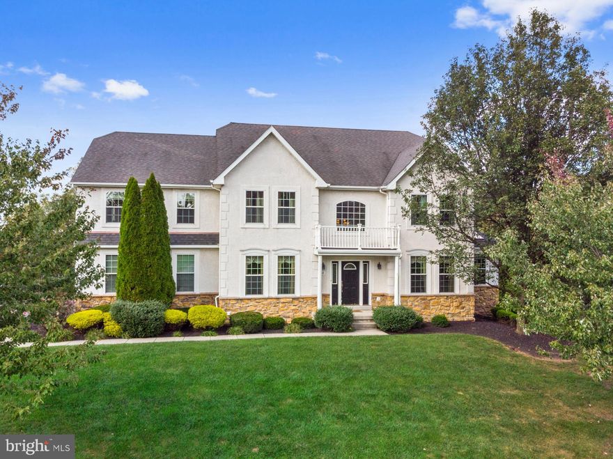 This Showplace in Country Ridge Estates has an outrageous outdoor oasis that is an entertaining and recreational mecca. As you approach the private rear yard, you will descend the grand staircase to the incredible stamped concrete patio. Here you will be greeted by the spectacular in-ground pool accented with stone walls, elevated spa, custom stone fire pit, summer kitchen with stone and granite tops and equipped with refrigerator, built in grill, kegerator and sink. This area flows into the extensive covered patio before entering the full finished basement.  For more fun, there is a bocce court with overhead lighting so it can be enjoyed day or night. The inside of this home is stunning as well. Enter the front door into the two story open Foyer with hardwood floors. The Living Room and Dining Room greet you from either side of the Foyer. The Dining Room features crown molding, chair rail and a butler's pantry. Into the two story Family Room, you will be enamored by decorative columns, gas fireplace and an array of windows that let sunlight fill the space. From here you can access the Study with vaulted ceiling and four skylights. The Kitchen boasts granite countertops, an island, stainless steel appliances and tile backsplash. It's a kitchen fit for a chef. Off of the Kitchen is the stunning Sunroom which doubles as a private retreat. Cathedral ceilings and hardwood flooring making this room magical; along with the incredible view of the backyard. There is a slider door leading to the large deck so you can easily get down to the backyard to enjoy the fun! Upstairs to the Master Bedroom you will notice how unbelievably large it is. Decorative columns, cathedral ceiling with fan, sitting room, TWO large walk-in closets and a full Master Bath with two separate vanities, soaking tub, and separate shower are some of the details that make this room unique. The remaining three bedrooms are all well sized with ceiling fans. The Hall Bathroom showcases a beautiful vanity with granite countertops and a fiberglass shower/tub combination. Completing this marvelous home is the Laundry Room which leads into the 3-Car Garage and the state of the art finished basement. This fully finished, walk-out basement features custom bar, movie screen with projector, full bath and bedroom. A perfect space for entertaining, out of town guests or an in-law suite.  Minutes to Routes 422 and 29, Phoenixville and Providence Town Center.