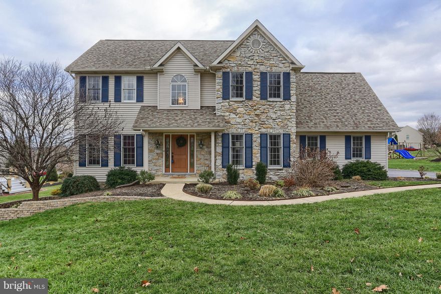 Absolutely lovely and beautifully updated home with soaring 9' ceilings. . . Bright, open 2-story foyer with turned stair & hardwood floors is warm & welcoming/Hardwood floors throughout almost the entire first floor/Lovely Cook's Kitchen loaded with amenities including Maple cabinetry, stainless steel appliances, large serving island, pretty Breakfast Room with sliding doors to rear deck & convenient built-in desk/Huge Family Room with cozy corner fireplace/Very Pretty formal Living & Dining Rooms/Nicely Finished Lower Level Family Room with half bath/Oversized rear deck is great for outdoor entertaining/Luxurious Master  Suite with vaulted ceiling & splashy Master bath with walk-in shower, garden tub & double vanity/New Roof 2017,  Garage Doors & Shutters 2018/Some updated systems in 2014 & 2015