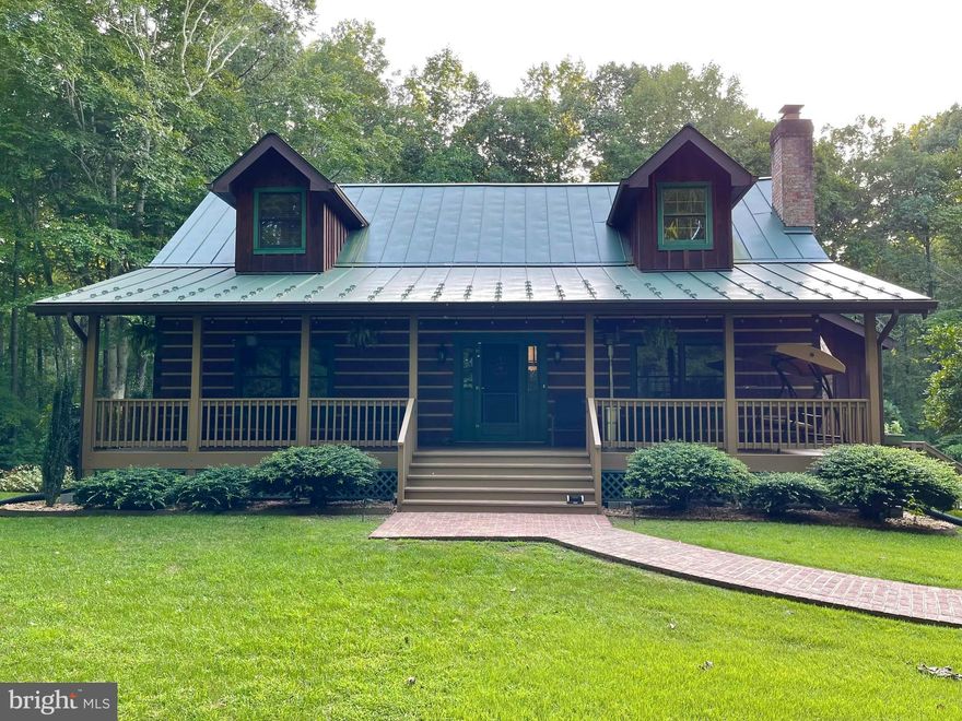 Welcome to this charming home that is truly more like a retreat. Nestled on a private 10+ acre lot in the Lakeland Forest neighborhood, it’s almost too easy to forget that you’re still in the heart of Stafford. This one-of-a-kind log home features 2 bedrooms and 1 full bathroom on the main floor, with the primary bedroom, full bathroom and loft upstairs. The newly finished walk-out basement offers 2 more bonus rooms (currently being used as NTC bedrooms) and another full bath. From the main floor, you can walk out on either of your two large, covered decks and enjoy the beautifully landscaped property; about 3 acres of which is already fenced in. The 300-gallon koi pond and custom chicken coop and run (complete with chickens and bunnies already) are just a few things that make this property a real dream come true. With countless updates in the interior and exterior, there’s almost too much to list.