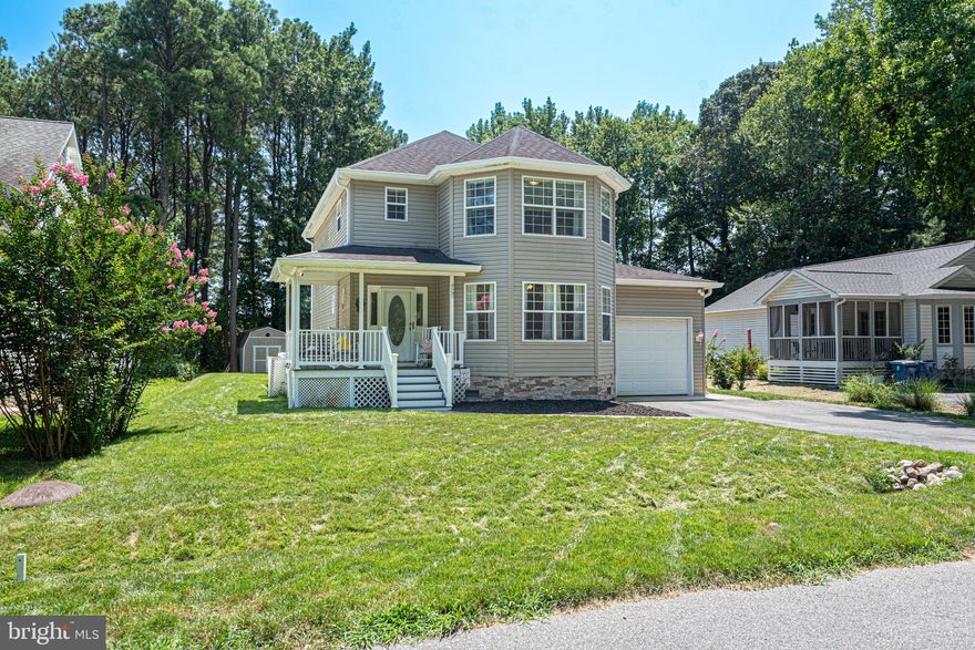 Modern comfort and coastal living at 42 Martinique Circle.  Discover the perfect blend of updated features, smart design, and serene surroundings in this spacious 3-bedroom home tucked away on a quiet street in the sought-after Ocean Pines community. Inside has great flow from the welcoming foyer to dining room, into the open kitchen and living room.  Abundant natural light, cozy fireplace and charming breakfast nook highlight the great room. The kitchen features stainless steel appliances and ample cabinet storage and countertop space. Take in the beautiful backyard views or star-filled sky from the amazing, one-of-a-kind, glass Victorian Conservatory by Four Seasons. State of the art, year round conditioning provided by the Daikin Atmosphera 2-ton mini split (installed in 2024 with transferrable 12-year parts and labor warranty), built to heat and cool in any weather.  Other recent upgrades provide peace of mind and energy efficiency, including  Gladiator digital hot water heater (2023), propane gas HVAC system (2022), heat pump HVAC (2021).  Step outside to your private backyard oasis—featuring a composite deck, newer hot tub (2023), concrete patio and large shed.  The open, well manicured backyard is a true highlight, offering plenty of space for outdoor living, play, pets, or future landscaping dreams.  Last year the yard was professionally graded, trees removed and underground gutters drainage installed.  Enjoy built-in wiring for outdoor surround sound, ideal for gatherings or peaceful evenings outdoors.  Located just minutes from the beach, golf courses, parks, and all Ocean Pines amenities—pools, marina, clubhouse and more—this home is a rare find!