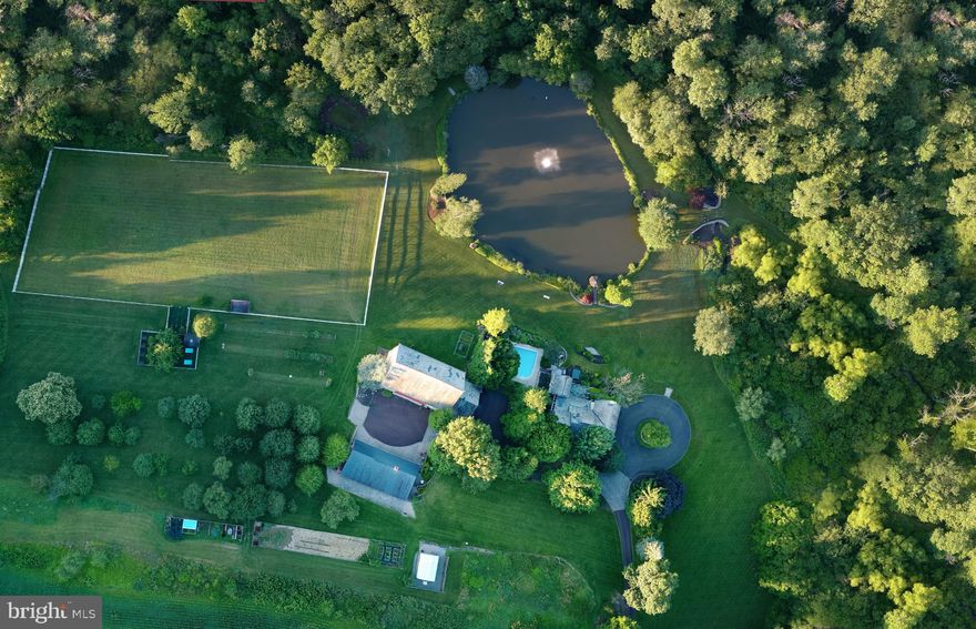 A once in a lifetime opportunity awaits you. Fieldstone Farm, built in the late 1700's, was deeded in 1740 under the William Penn Walking Treaty Land Grant of 1737. This exquisite country estate, gated with state of the art security system on a peaceful, private & pristine 120 acres, overflows with amenities including a magnificently restored farmhouse & bank barn. Marvel at the fine details of random width cherry floors, detailed moldings, pointed stone walls, 4 gas fireplaces, 4 bedrooms, 4.5 baths, restored summer kitchen, gourmet kitchen w/top-of-the-line appliances, and a sun-filled great room to veranda for the finest in entertaining. Extraordinary features continue with an 8-car carriage house garage built in 2004, additional 3-car garage, heated pool & spa, 1500 sq. ft. entertainment room, and 2-acre stocked pond w/fountain. For nature lovers, enjoy the orchard, state-of-the-art greenhouse, organic garden, beautiful Indian creek with trails for hiking and cross-country skiing, plus 3 horse stalls, tack room & paddock. Low Taxes. Isolated, secure, yet close to world-class health care and all the amenities of fine living. Easy commute of less than one hour to New York, New Jersey and Philadelphia. Space for a helipad! This is a rare opportunity. Perfect for a private estate, hobby farm, family retreat and a wonderful healthy lifestyle!  Please contact the listing agent for a link to the detailed virtual walk through video.