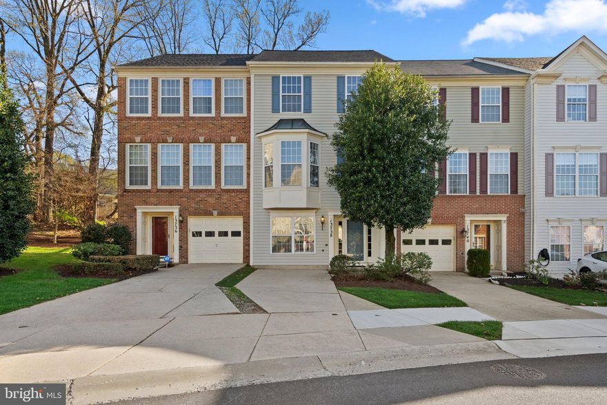 A beautifully maintained 3.5-level townhouse in the heart of Germantown!

Step into this spacious and light-filled home featuring hardwood floors throughout the main and top floor, including the stairs.  Additionally, there's brand-new plush carpeting that adds a fresh touch in the lower-level recreation room. The main level boasts an open and inviting layout with a cozy gas-burning fireplace, a convenient half bath, and direct access to a large wood deck—perfect for entertaining or enjoying peaceful evenings outdoors.

The kitchen has oversized bay windows that flood the space with natural light, a large central island, and sleek stainless-steel appliances.

Upstairs, you’ll find three generously sized bedrooms, all with ceiling fan lights, and a full hallway bath. The primary suite is a true retreat with a large ensuite bathroom complete with a soaking tub, separate shower, dual-sink vanity, and a spacious walk-in closet.

The lower level features a private bedroom and full bath—ideal for guests or a home office—as well as a separate laundry room for added convenience.

Parking is a breeze with both a private driveway, and separate parking space #13. This home combines comfort, style, and functionality in a desirable Germantown location close to shopping, dining, and commuter routes. Don’t miss this one!