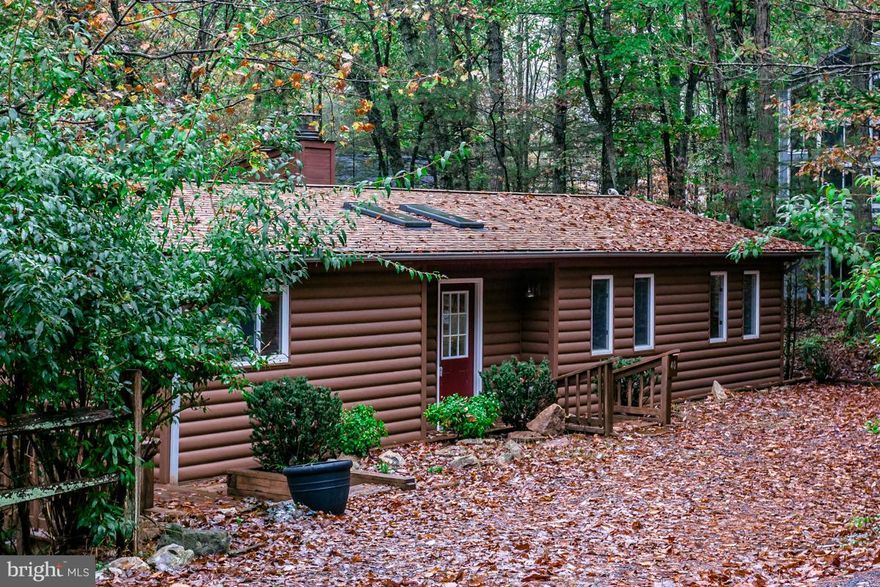 Home's main level offers Kitchen w/ dining area open to living rm w/ woodstove! Living rm offers access to the sun room that overlooks the back yard! 3 main level BRs, including one w/ en suite & private deck! Finished walkout lower level offers family rm w/ FP, large laundry rm, full BA, & 2 additional rms! Freshly-stained 2-story wrap-around deck, new roof added in 2017 & pull-up drive way!