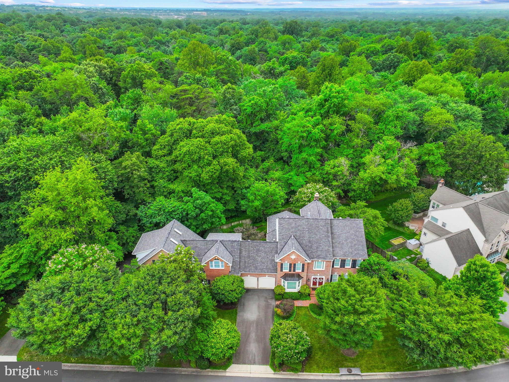 This unique, colonial style single family home has a 2,200 SF two story expansion in addition to the original house of 3,400 SF. The original house has 4 bedrooms and 4.5 baths. The kitchen was redesigned with a large open spacious area. The ground level first floor expansion has a 1,100 SF woodshop, and the top level is a 1,100 SF studio with plenty of storage, its own entrance, and access to the main house. There are two separate driveways. The original driveway has a one car garage and space for a recreational vehicle or lawn care equipment. Lots of storage. The second driveway goes into the woodshop. The woodshop, which can be used for multiple purposes, could hold up to two cars, or with some minor modifications, up to 4 cars plus the 1 car in the original garage. The back of the home faces Ellanor C Lawrence Park with only a neighbor on one side. It has a walk-up basement with double French doors. All hardwood floors on the main level and has a large sunroom addition with windows overlooking the county park. Less than 15 minutes to the Dulles airport and close to many grocery stores, shops, restaurants, schools and places of worship.