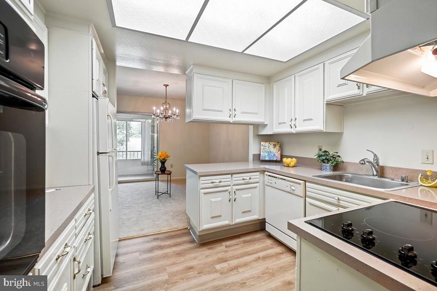 Gated 55+ Active Adult Community. This “Raleigh" floor plan in Montgomery Mutual offers so much to love.  This generously sized 1 bedroom, 1 bath has an enclosed balcony.  It’s located close to Clubhouse I and across the street from the 18th Fairway of the golf course with views from the enclosed balcony and bedroom.  It offers large rooms and generous closet space. It’s ready to go with fresh paint, new carpet, new LVP flooring in foyer, kitchen and bath. New cooktop in the kitchen and the kitchen countertops have been refinished with an epoxy laminate.  Lots of cabinetry and countertop space in the bright kitchen, which adjoins the Dining Room and a large Living room with sliding glass door to the balcony.  Storage cage and an assigned parking space too. The monthly fee includes both the Co-op and HOA fees, all utilities, basic cable TV, Wi-Fi, property taxes, most maintenance of the unit, appliances and HVAC, PLUS all of the wonderful community amenities.  It's resort living – with 2 clubhouses, a fitness center, indoor and outdoor pools, walking trails, tennis and pickleball courts, game rooms, 18-hole golf course, restaurants, clubs, activities, and much, much more!  And the grounds are so beautiful with abundant green space and delightful wildlife.  Come see for yourself!