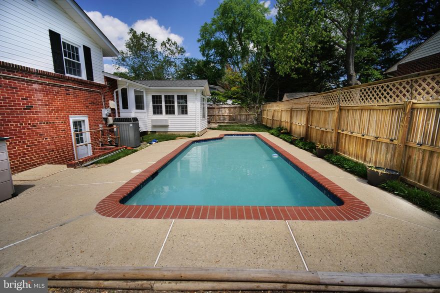 Calling all dog  lovers:
Fort Hunt Park neighborhood back-trail/path is just a few houses away behind the property, George Washington Parkway/bike path/walking trail in 3 blocks, Mount Vernon Estate & Fort Belvoir just down the road in this all Single Family home community with no HOA.

Elegant & chic new renovation at this charming Fort Hunt neighborhood in Potomac Valley subdivision community home.

Bay windows in the living room & eat in kitchen, primary bedroom w/ en-suite overlooks the backyard & the pool.
Warm refinished hardwood floors on the top two levels & fresh paint using designer fixtures/lights throughout.

Bright all above grade living space in the lower level has water proofed durable flooring.
Perfect for a kid's play space or live-in au pair area has a separate own entrance/exit to the backyard.

Spacious in-law-suite/guest areas or use as library/office has built in wall units plus a huge finished 'crawl space' for extra storage & more storage in the utilities room with walk-up stairs.

 Sun room (floor-water proofed flooring) addition leads to the brick patio. Fabulous for cooking & entertaining in the fully fenced in private corner lot.