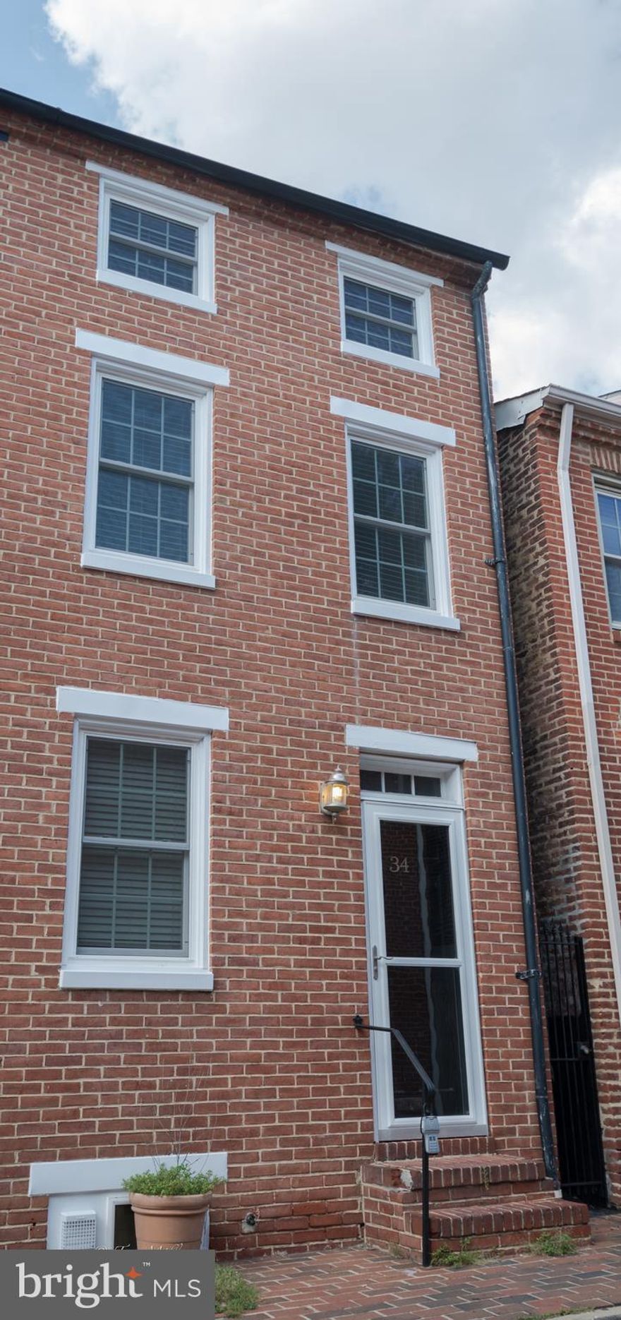 Charming and conveniently located steps from Cross Street Market, and 5 minute walk to stadiums. Set on a quiet, historic street in Federal Hill, this home has all new pella windows, wood burning fireplace in living room, bedrooms on separate levels each with their own full bathroom. Private patio off of kitchen great for entertaining. Priced to sell - Come see this gem before it goes!