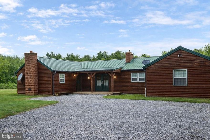 Don't Miss This One for Residential or Commercial Use!  **Seller is Motivated**Zoning is GU-R and was previously zoned Commercial.  The possibilities are endless with this property.  The property was once an antique shop and a profitable Airbnb as a large source of income.   This charming 1953 ranch-style home offers a perfect location bordering I68, Exit 56 and only 5 miles to Rocky Gap State Park, Golf Course, and Casino.  This home is a perfect blend of comfort and functionality, nestled on a spacious 1.1-acre lot.  Step inside to discover an inviting open floor plan adorned with beautiful hardwood floors and ample natural light and lighting fixtures.  The heart of the home features a well-appointed kitchen with a wood-burning fireplace and butler's pantry, ideal for culinary enthusiasts.  Enjoy cozy evenings by the gorgeous propane fireplace.  You can snuggle up in the bedroom with a good book and electric fireplace adding warmth and character. The main level includes 1.5 baths, 3 outside exits, 4, entry-level bedrooms.  While the partially finished basement provides space for an additional bedroom with a 4th fireplace,  laundry area, workshop/man cave or recreation area.  Outside, the property boasts a level yard with stunning mountain and valley views, perfect for outdoor gatherings or peaceful retreats. With a convenient attached garage and ample driveway parking, and a shed, and 3 sewage hook-ups this home is designed for ease of living or conversion back to a commercial space.  The home was remodeled inside and out in 2012 including a metal roof.  There are T/G pine walls and hardwood floors throughout.  Experience the tranquility of this delightful residence, where every detail invites you to create lasting memories.  Numerous commercial opportunities exists and once as a financial successful Airbnb  The potential is here and waiting for a new residential or commercial owner!  Call for your appointment today!