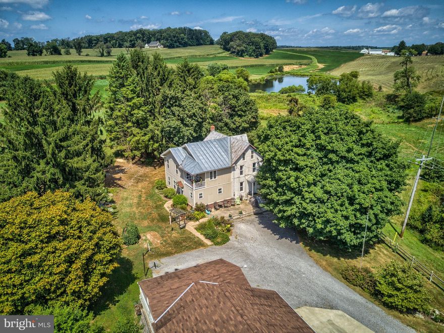 Attention Horse and Nature lovers! Nearby trails at Pretty Boy Dam for your pleasure. This beautiful, tranquil setting with a home that boosts proud ownership. This is not a drive by property. It has so many amenities for you to see. The home was remodeled in 2002 with beautiful updates. Hardwoods throughout most of the first floor. Lots of storage in the kitchen remodeled with solid maple carpentry, Corian countertops, stainless steel appliances and an island. Kitchen opens to the spacious family room for entertaining. Dining room finished with chair rail and crown molding. Living room has custom made built-in shelves and cabinets. Second floor laundry area. The master suite has vaulted ceilings, walk-in closet, master bath with jetted tub, shower and balcony. The views are wonderful overlooking the pond. Four stall barn supporting a wash stall, heated tack room, fenced in pastures, hay field, large garage and or storage area large enough for your boat or camper. This in addition to the four car garage at the home. Call me to view this beautiful home.