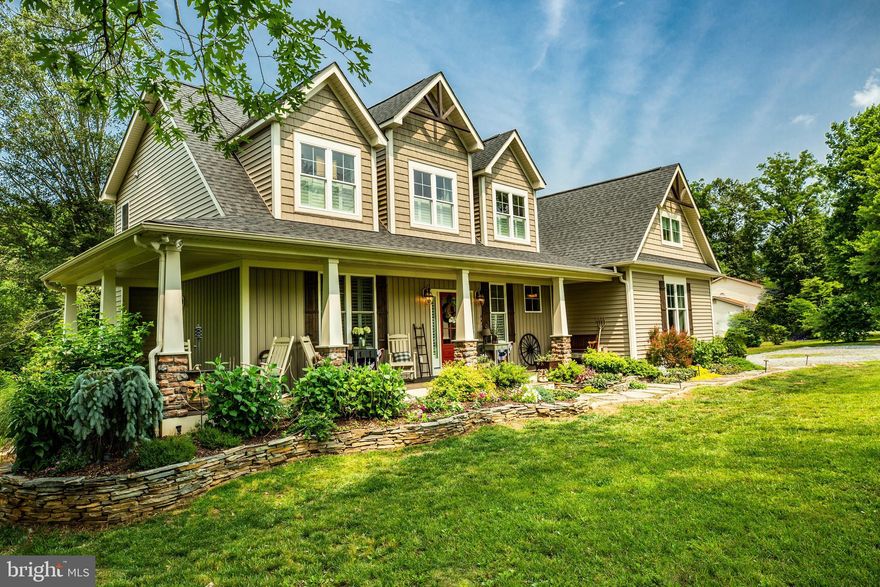 Absolutely STUNNING Modern Farmhouse with Top of the Line Finishes on a BEAUTIFUL Private Treed 5.5 Acre Secluded Lot located minutes to 95! Custom Built Luxury MODERN Open Concept Home features a Welcoming Wrap-Around Front Porch, Spectacular Main Floor Owner's Suite with a Free-Standing Soaking Tub, Awesome SPA Shower, Double Vanities and Fabulous Luxury Finishes on Private TREED Acreage minutes to 95, Old Town Fredericksburg, DC Commuter Express Lots and Quantico Marine Base. THIS is the Home of Your HGTV 'Fixer Upper' Dreams! My clients built their "Forever Home" and just got transferred...Vacation at Home this Year on the Wrap Around Porch, surrounded by a Perennial Garden, overlooking the Old Oak Tree with the Tire Swing...leave your day behind and grab an Iced Tea! Welcome Friends and Family to the Gracious Foyer with Plantation Blinds and Settle in to the Great Room in Front of the Wood Burning Fireplace or Head Outside to to the No-Maintenance TREX Deck for a Night Out Under the Stars, Overlooking the Sunset. Everyone will Gather in the Gourmet Kitchen Island before Sitting Down at the Box Window Dining Room Overlooking the Treed Acreage! The Main Level features Imported Garneau Wide Plank Solid Hardwoods. The Kitchen...Knotty Alder Custom Coffee Bar and Stunning White Painted Hardwood with Accent Glass Cabinets, and Ledge Stone Back-Splash, Wine Rack, Double Commercial Fridge, Gas 5-Burner Cooktop, Granite Counters and an Gold/Silver Onyx Island that you can Undermount to Light Up! Designed for Open Entertaining, this Large 4 Bedroom, 4 Bath Home Offers Bonus Space to Build Equity in the Walkout Basement. This Unfinished 3rd Level is Fully Roughed in for a 5th Bathroom and has already been Pre-Framed with Space for an Additional 5th Bedroom/In-Law/Guest Suite, Media Room and Rec Room. The 5.5 Acre Lot is Framed by Mature Shade Trees and Ready for any Gardener, with Sunny Open Planting Areas, Apple and Peach Trees, as well as Blueberry and Raspberry Bushes. This Home offers Gracious Modern Country Living at it's Very Best in a Location 5 Minutes from Downtown Fredericksburg with Shopping, Dining & Commuter Options. Welcome HOME!Please come to Our Open House on Sunday!