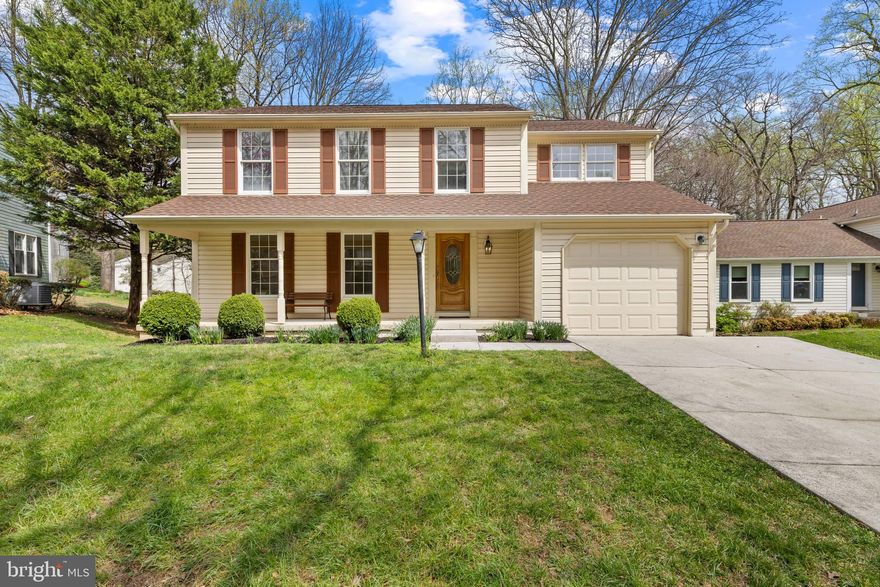 Beautifully updated and thoughtfully refreshed, this charming Colonial residence offers 4 bedrooms, 3.5 bathrooms, 2,080 finished square feet, and a 1-car attached garage in the desirable Sewells Orchard community. Lovingly maintained by the original owner, the home showcases numerous updates, including refreshed drywall and paint, new carpeting, updated lighting, and a recently replaced HVAC system (2025), creating a move-in-ready, modern living experience. // A welcoming front porch sets the tone as you enter the main level, where a hardwood foyer and an updated powder room (2026) greet you. The formal living and dining rooms are spacious and inviting, featuring carpeting, a classic chair railing, and an elegant chandelier, seamlessly connected for effortless entertaining. // The heart of the home is the completely renovated eat-in kitchen (2026), designed with both style and function in mind. Highlights include hardwood flooring, freshly painted cabinetry with updated hardware, quartz countertops, updated stainless steel appliances, a breakfast bar, and a sunny breakfast room with access to a covered patio. Just beyond, the family room offers a warm and welcoming retreat with hardwood floors, a soaring cathedral ceiling, a brick-accented wood-burning fireplace, and direct access to the deck. // Upstairs, the primary suite features vaulted ceilings, a walk-in closet, and a beautifully appointed en suite bath with a separate vanity area with a second sink. Three additional bedrooms—one with a walk-in closet—offer comfortable accommodations, along with a full hall bath updated with LVP flooring, a mirror, a light fixture, an exhaust fan, and refreshed cabinetry.  // The fully finished walk-out lower level expands the home’s versatility with a spacious recreation room, featuring a full bath and sauna, a flexible bonus room with a walk-in cedar closet, a dedicated utility/laundry room with washer and dryer updated in 2024, and a storage area. // Outdoor living is equally inviting, with a covered patio providing shaded relaxation and seamlessly connecting to an open-air deck with steps leading down to a tree-lined backyard.