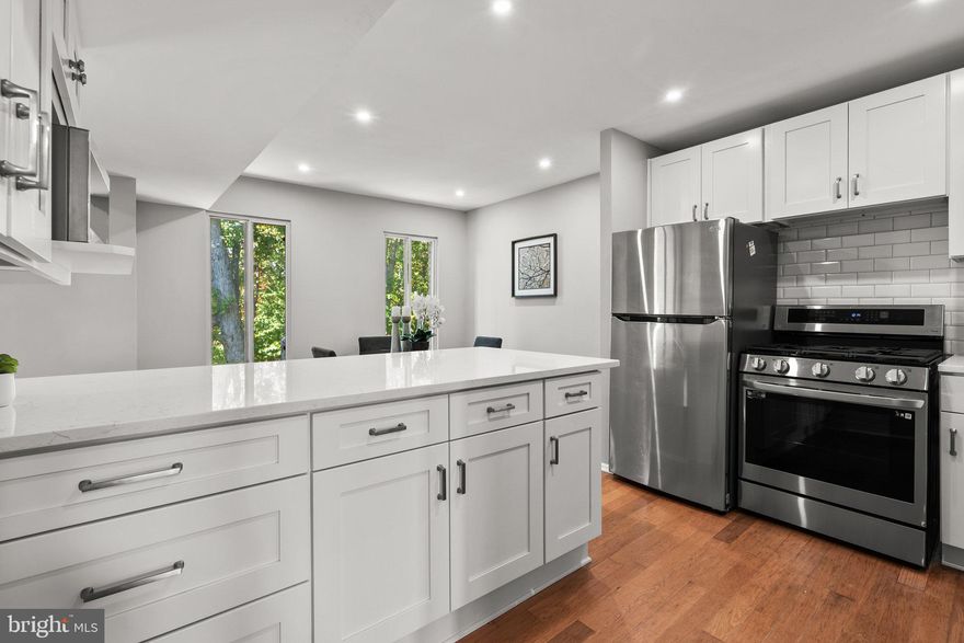 Welcome to modern sophistication in this bright and newly renovated 2-bedroom, 1.5-bath Arlington home in sought after Park Spring Condominiums with lovely park views! Located near Shirlington, the Pentagon, key commuter routes, and the W&OD trail, this home is situated in a quiet enclave with easy access to vibrant shops and restaurants offering an exciting and convenient close-in lifestyle! Step inside and you will find a separate entry foyer to welcome guests and gorgeous hardwood floors throughout. Next is the spacious living room with glass doors leading to a large balcony overlooking Tyrol Hill Park, extending your living space for al fresco dining and relaxing. The dining room is open to the brand-new kitchen where you have a breakfast bar, recessed lighting, new cabinets, all new SS appliances and sleek quartz countertops. You will love the gorgeous, newly updated bathrooms and 2 large bedrooms including the primary suite. And don’t miss the in-unit washer and dryer, loads of closet space, included storage area, community swimming pool, tot lot and basketball court, and 2 coveted parking passes. Gas, water, sewar and trash included in condo fee. Welcome home!