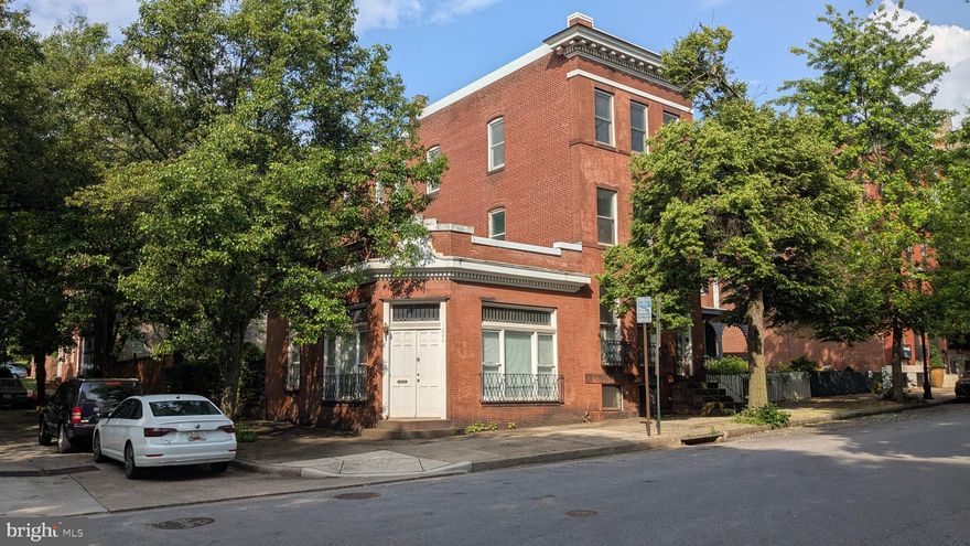Incredible opportunity to restore a unique, very large, historically significant property in an amazing Bolton Hill location. This estate  sale includes both 1202 Bolton St - the main house, and 1200 Bolton St - a former shop that has been converted into a studio apartment. Charles Fox, noted Baltimore florist, built the main house in 1900, as well as the adjoining structure the same year. The large, 3 story main house was his personal residence, while the attached building was his flower shop. Behind both buildings is a very large lot for the neighborhood - 700 sq ft behind 1200 and 1,400 sq ft behind 1202, totaling a huge 2,100 yard with brick walls with doorways separating them.  The main house is 3,600 sq ft, and is currently set up as follows: 1st floor - large living and dining rooms, a main staircase and a rear staircase, a half bathroom, and a good-sized kitchen with access to the rear yard. 2nd floor - two  bedrooms, a den, and a full bathroom. 3rd floor - 2  bedrooms, a den, a second kitchen, and a full bathroom. Basement - runs the full length of the house, and has tall enough ceilings to finish this space, and walkout stairs to the rear yard.  The main house has original wood floors, very tall ceilings, some original molding, and many, many windows flooding it with natural light. Because the house is partially detached on one side and 1200 is only one story tall, much of the main house feels fully detached. 1200 Bolton (situated at the corner of Bolton and Dolphin Streets) is 560 sq ft one one level, and features a main room with huge storefront windows, a kitchen with access to the rear yard, and a full bathroom. 1200 also has central air conditioning. The main home does currently have water damage and the presence of both mold and lead paint, but both properties had full roof replacements in 2022. The studio at 1200 is in better condition, but also could use some deep cleaning and light renovation. The possibilities are many - the third floor kitchen and den could be combined to make a 6th bedroom,  there is an opportunity to expand or add full bathrooms in the large floorplan, and the basement could be partially or fully finished. The current studio apartment could be rented out for a great income stream, or used as an office, music or art studio, or whatever else you can imagine. The large backyard offers endless possibilities. At one point in time, the previous owners had off-street parking accessed via Dolphin St, so that is a possibility too. Don't miss the opportunity to return this piece of Baltimore history to its former glory. Interior photos and floor plans will be added soon. The properties are located in the Midtown Special Benefits District and and subject to an additional annual tax of $583.52 and $232.49 respectively.