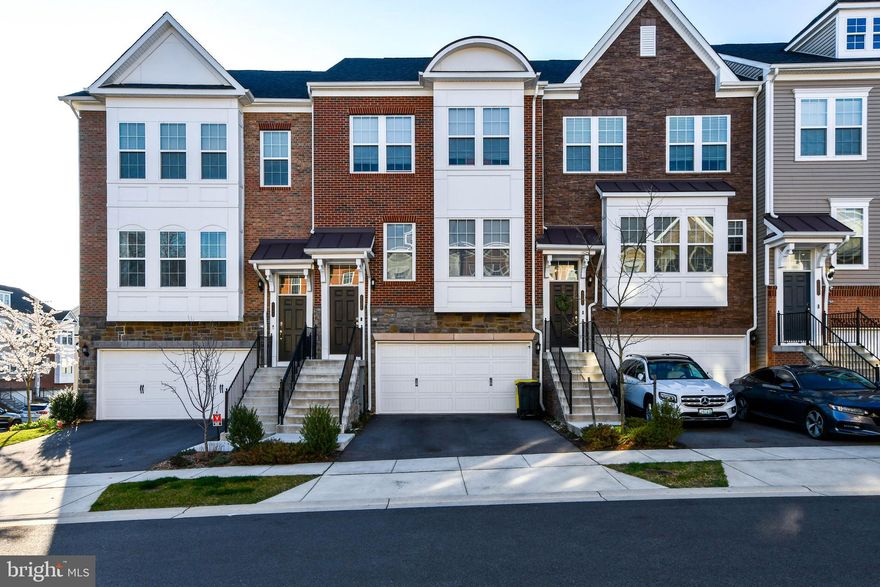This GORGEOUS townhome features an open floor plan including the kitchen, dining and living area. The open floor plan is on the main level, which also has a sunroom extension with a deck, hardwood floors, granite countertops and maple espresso kitchen cabinetry. The lower level features a very spacious and finished basement, half bathroom and a walk-out entrance/exit area with a patio. The upper level has an owner's suite, owner's full bathroom, two large walk-in closets, a second bedroom, a third bedroom, hallway full bathroom (second full bath on upper level) and the laundry area. OPEN HOUSE SAT & SUN 4/15/23 and 4/16/23 from 12pm - 2pm.