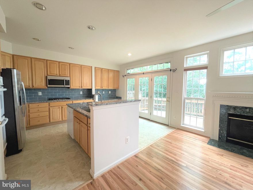 Welcome to 2757 Manhattan Place! A beautiful 3 level townhome with a location that can’t be beat! This 4 bedroom and 3.5 bath home is move in ready! As you walk up the steps to the main level, you are welcomed by an open concept layout, large oversized windows that let in lots of light and gleaming hardwood floors. This level features a spacious & light filled living room, dining room, family room, half bath and a newly updated kitchen that flows into a breakfast area that leads to the deck. The kitchen offers plenty of cabinet and counter space, stainless steel appliances, including a double door fridge with ice maker! Enjoy the gas fireplace in the neighboring family room. Streams of light flow into the kitchen and family room with the floor to ceiling windows!
Upstairs, you will find 3 large bedrooms and 2 full baths. The spacious, freshly painted main bedroom has a walk-in closet and an en-suite bathroom with a soaking tub and a separate shower. The bath/shower combo in the 2nd bathroom was just updated with a new bathtub with floor to ceiling tile. There is also a washer & dryer on this level for added convenience. 
The entry level has a large 2 car garage, a bedroom, full bath and 2nd family room with walkout basement access to an outdoor brick patio. This home is walking distance to everything! Steps away from Dunn Loring metro station! Walking distance to Harris Teeter, shopping, dining, and entertainment at the Mosaic District! All major commuter routes 29, 495, 66, 7, 123 and 50 are less than 2 miles away. STENWOOD/KILMER/MARSHALL School Pyramid.