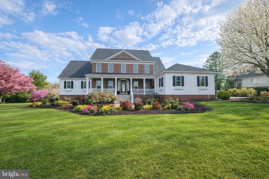 Welcome to this stunning Providence II model by Selfridge Builders in the sought-after Fox Valley Estates. Featuring a classic brick front and an inviting covered front porch, this southern style home combines lavish style with thoughtful modern upgrades. A dramatic two-story foyer welcomes you and hardwood flooring flows throughout most of the main level. All three levels of the home feature 9-foot ceilings, creating an open and airy feel throughout. The beautifully updated gourmet kitchen is the heart of the home and showcases on-trend white cabinetry, upgraded quartz countertops, a large center island with seating for four, and upgraded stainless steel appliances.  The adjoining breakfast area with cathedral ceilings is the perfect spot to enjoy morning coffee. The impressive two-story family room is filled with natural light from a wall of windows and features a cozy gas fireplace and built-in shelving, creating a warm and inviting gathering space. Elegant formal living and dining rooms feature hardwood flooring and extensive moldings, perfect for both entertaining and everyday living. The main level office is enhanced with custom built-ins, offering an ideal work-from-home space. The main-level primary suite is a true retreat with hardwood flooring, cathedral ceilings, a large walk-in closet, and direct access to the deck through French doors. The luxuriously updated primary bath features a frameless glass walk-in shower, a freestanding soaking tub, and a double vanity with upgraded countertops. Just off the oversized two-car garage that is wired for EV charging, the convenient welcome center provides a dedicated laundry area and ample space for everyday organization. The upper level offers four spacious bedrooms and two full baths. One of the bedrooms could easily serve as a second primary suite, complete with a large walk-in closet and convenient access to a full bath. The walk-out lower level expands the living space with a large recreation area ideal for entertaining, complete with a wet bar. This level also includes a possible sixth bedroom and a half bath, perfect for guests.  A home gym and large storage area complete the lower level..
Outdoor living is just as impressive with a low-maintenance screened porch that overlooks the deck, paver patio, and flat backyard—the perfect setting for relaxing or entertaining.  Fox Valley Estates features a neighborhood pool and tennis court and is ultra convenient to commuter routes and all the modern conveniences in Clarksville and Ellicott City.  This exceptional home blends space, style, and functionality in one of the area's most desirable communities!