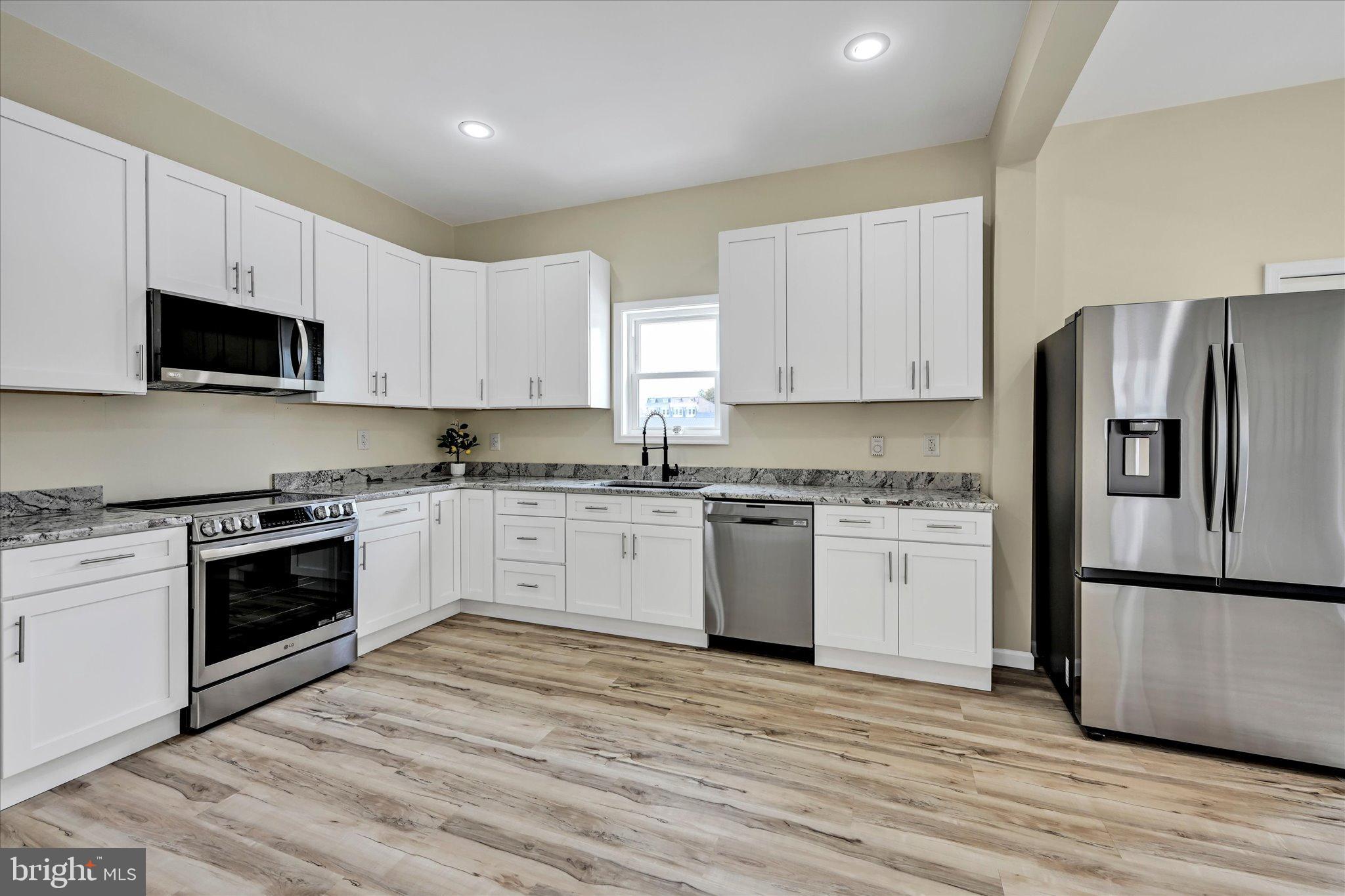 Beautifully Remodeled 4-Bedroom Home with a Bonus Room in Frackville. This spacious 2,200+ sq. ft. home blends modern updates with timeless character, offering soaring ceilings, abundant natural light, and a comfortable floor plan. The main level features a welcoming living space, a full bath, convenient first-floor laundry, and a bright kitchen with brand-new stainless steel appliances. A cozy breakfast nook overlooks the large yard with offstreet parking, while the Trex deck just off the kitchen provides the perfect spot for morning coffee or evening gatherings. There’s even room to add a center island for those who love to cook or entertain in the spacious kitchen. Upstairs, you’ll find four bedrooms with plenty of closets, a second full bath, and a dedicated office with its own private entrance—ideal for today’s work-from-home lifestyle. The full walk-out basement offers plenty of potential to be finished into additional living space, a recreation room, or a home gym. Additional highlights include energy-efficient hydronic electric heating, off-street parking, and a large yard that provides space for play, gardening, or outdoor entertaining. This home is move-in ready, offering comfort, function, and room to grow in a great location. Don't miss out.