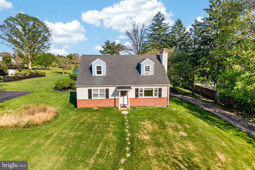Nestled on a peaceful non cut-through cul-de-sac street, this home offers the perfect blend of privacy, convenience, and location. Situated on a spacious half-acre lot backing directly to the grounds of Schuylkill Township Elementary School, the backyard provides a scenic and open setting to enjoy year-round. Relax on the covered porch or unwind on the brick patio while taking in the private backyard views.  A large driveway wraps around to the rear of the home and leads to the attached one-car garage, offering plenty of parking and functionality. Inside, wood flooring flows throughout the living room and bedrooms, adding warmth and character to the home. With two full bathrooms and generous living space, there is plenty of room to make it your own.  The unfinished basement offers excellent storage space along with incredible potential for future finished living space, complete with a wood-burning fireplace ready to become the centerpiece of a cozy family room, rec room, or entertaining area.  Enjoy an unbeatable location just a short walk to the Greater Philadelphia YMCA - Phoenixville Branch and only 2 miles from the shops, restaurants, and vibrant community events of downtown Phoenixville. Outdoor enthusiasts will love being just 5 miles from Valley Forge National Historical Park, while commuters will appreciate the easy access to Routes 202, I-76, and the Pennsylvania Turnpike.