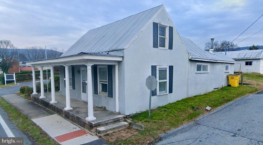 This 2 bedroom 1 bath home has good bones, situated close to historic Harpers Ferry. On the main level you have a large living room with pine floors, ceiling fan light fixture, beamed ceiling,  and lovely built-ins. The living room is open to your dining room. Here you have pine floors and beamed ceilings as well. Additionally, there is chair rail molding and wainscotting. What great details you don't see much anymore! The kitchen features tile floors and an open 1.5 story ceiling with exposed beams. There is a convenient passthrough to your dining room. On the other side of the kitchen is the laundry/ utility room. It includes a concrete floor, laundry hook-ups, and a 200 amp electric panel. The main level also houses the full bath. It features tile floors, 5 ft single bowl vanity and a porcelain tub with tile surround. Upstairs you have two generously sized bedrooms with pine floors, overhead light, and plenty of closet space. With a little TLC this home could shine again. Scheduled your showing today!