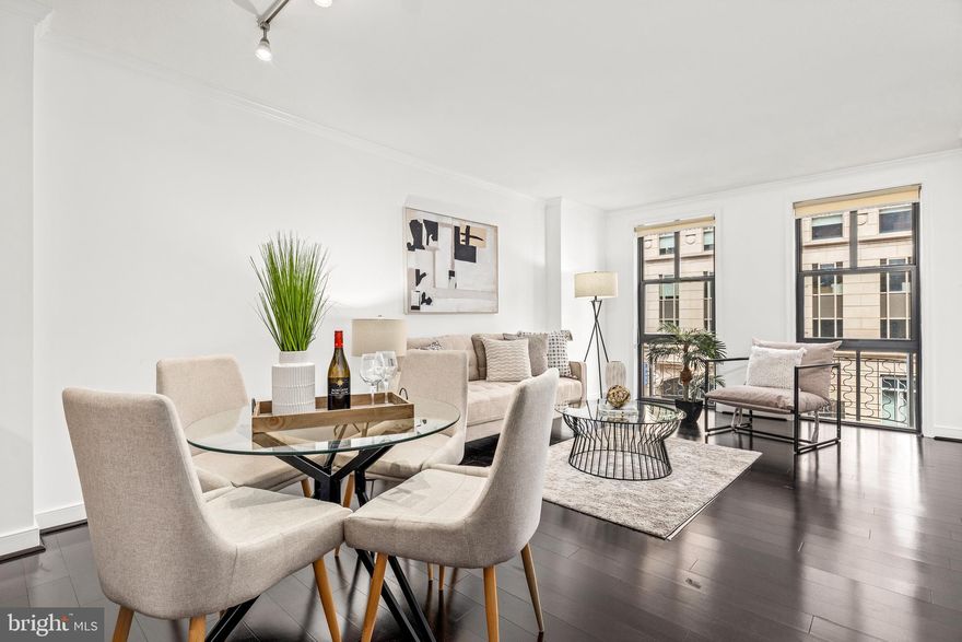 Welcome to the Clara Barton—a premier, highly sought-after residence in the heart of Penn Quarter! This freshly painted one-bedroom unit boasts beautiful hardwood floors and tall windows that fill the space with natural light. The open-concept layout offers versatile living and dining areas, perfect for modern living. The kitchen is well-appointed with ample cabinetry, granite countertops, stainless steel appliances, and a functional island that’s ideal for casual dining or entertaining. The spacious bedroom features abundant sunlight and a generous walk-in closet, while the oversized bathroom adds an extra touch of comfort. An in-unit washer and dryer make daily living even more convenient. The Clara Barton offers resort-style, pet-friendly living with an impressive suite of amenities, including a rooftop deck with a pool, grilling and dining areas, and iconic DC views. Residents also enjoy access to a private courtyard with a fountain, 24-hour front desk, business center, conference room, 30-seat theatre, party room, and fully equipped fitness center. Garage parking is available for rent. Located in vibrant Penn Quarter, you're just steps away from top-tier dining, world-class museums, theaters, the National Mall, and access to all Metro lines—offering the ultimate urban DC lifestyle.