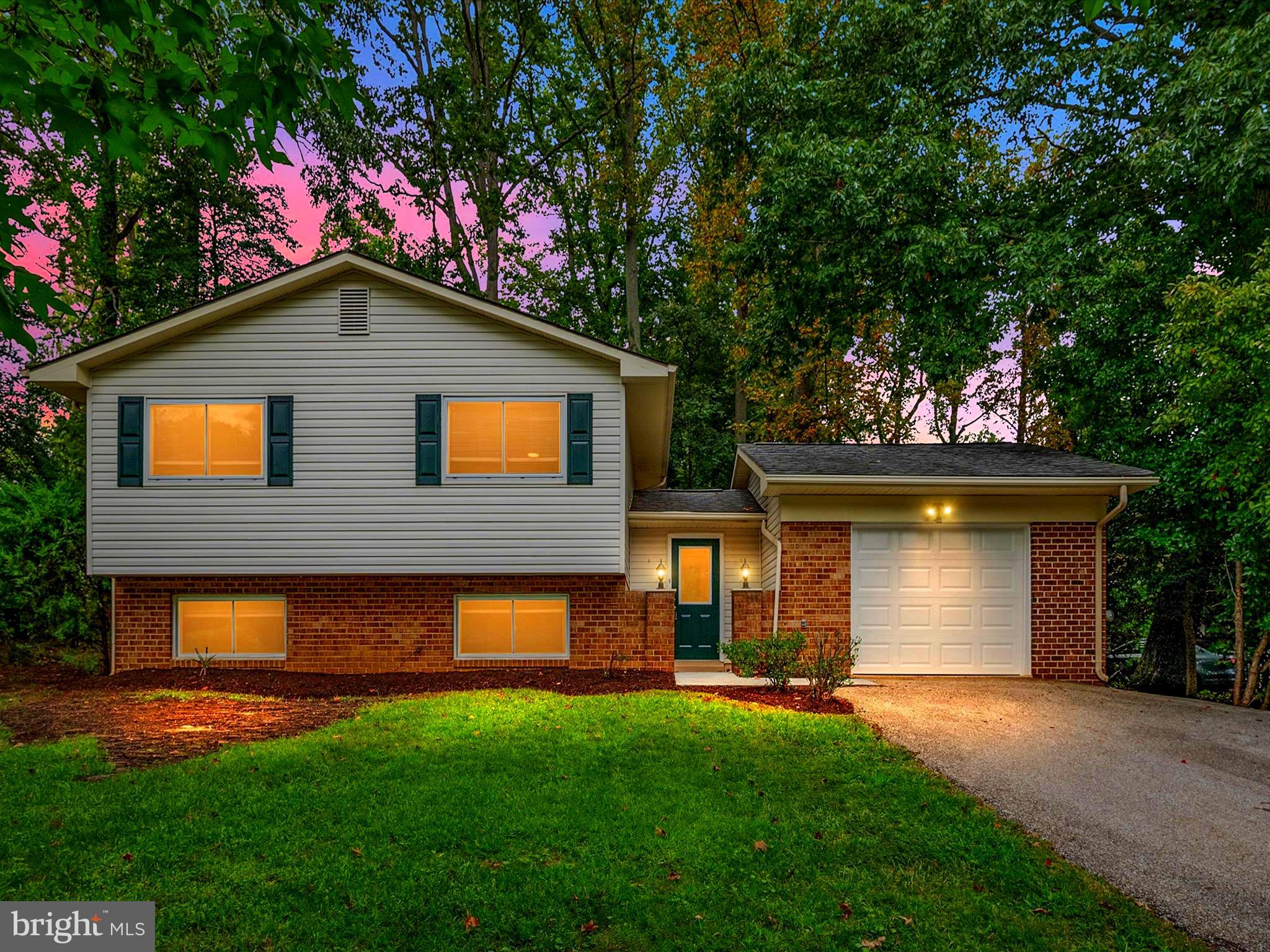 This charming home is ready for you to move in today, complete with numerous upgrades! The open layout is filled with natural light. The upper level boasts beautiful hardwood floors throughout and a nice flow for entertaining. The kitchen features a brand new refrigerator, and the house has a new garage door. On the lower level, you'll find a cozy wood-burning stove and plenty of space and storage. There is also another bedroom and a bonus room perfect for an office, gym, or extra guest bedroom. A full bathroom is also located on the lower level. The spacious fenced yard is situated on a quiet street. Enjoy all the amenities Hillsmere offers, including a pool, beach, and marina. Plus, you're just a short walk from Quiet Waters Park and local shopping. Experience the advantages of living in this desirable neighborhood!