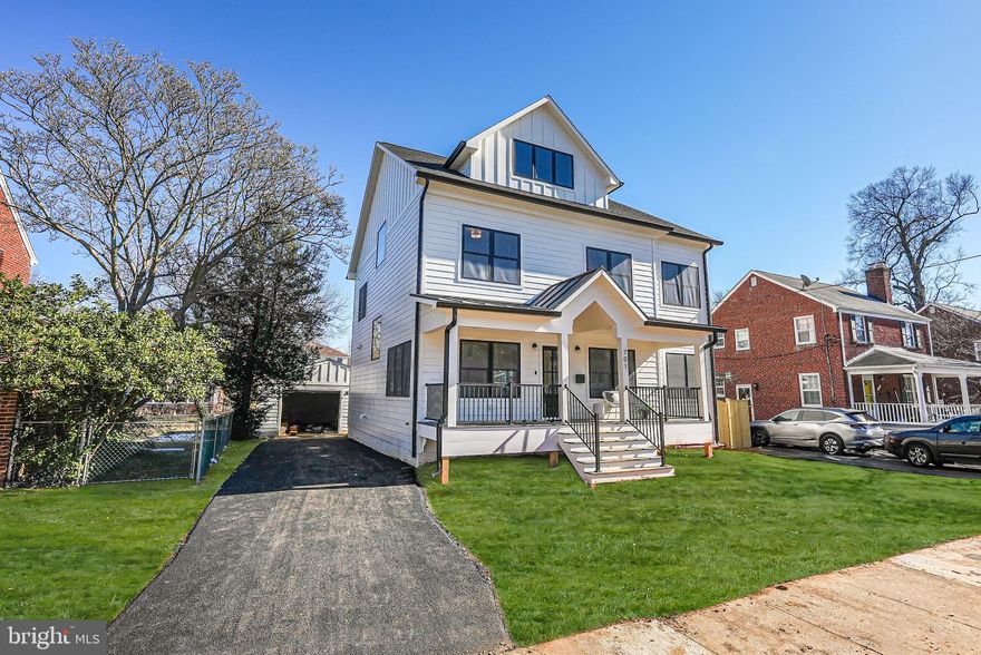 Discover a beautifully expanded four-level gem where exceptional design and craftsmanship come together on a stunning lot, just a short walk from Ballston Quarter and Bluemont Park. Offering nearly 3,800 square feet of luxurious living space, this home showcases timeless elegance with Hardie Plank siding, a charming metal roof accent, and an expansive front porch crafted with durable Trex decking.
Step inside and be welcomed by the warmth of newly installed 7.5 inch European White Oak floors that flow throughout the home. This thoughtfully designed residence includes five generously sized bedrooms and 5.5 meticulously crafted baths, including a spa-like primary suite that features a wet room and dual vanity. The main level boasts a stylish modern gas fireplace with a wraparound floating mantel, a formal dining room perfect for entertaining, and a gourmet kitchen designed to impress. The kitchen is a chef's dream, equipped with designer cabinetry, quartz countertops, a convenient beverage fridge, and high-end Café stainless steel appliances.
The fourth level offers a spacious loft complete with a dry bar and beverage center—ideal for additional family space or entertaining guests. The fully finished lower level provides a cozy retreat with a wet bar, perfect for movie nights or hosting friends.
Outdoor living is just as inviting, with a generous, fenced-in flat backyard featuring a built-in fire pit and a detached 1.5 car garage. Superior energy efficiency is built into the home, including comprehensive insulation, Low-E windows, dual-zoned HVAC systems, and durable 30-year architectural shingles.
Located in the desirable Bluemont neighborhood, this home offers the perfect blend of suburban charm and urban convenience. Enjoy walkable access to the Ballston Metro, parks, dining, and shopping at Ballston Quarter. Experience unparalleled comfort, style, and community living in this exceptional home.