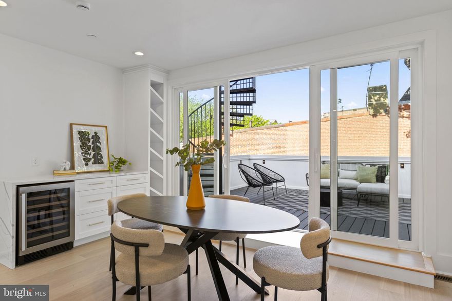 Welcome to 1825 N Capitol Street! This brand new 3 bed, 2.5 bath condo seamlessly blends classic DC row home style living with modern conveniences and timeless Victorian charm with a massive foot print of 2,206 sq feet! Custom built, this one of a kind residence represents the upper unit of this remarkable 4 story, 2 unit condo building. 
 
On the first level, you'll find the master bedroom featuring an elongated walk-in closet, a private balcony, and a pristine master en-suite bathroom boasting a full walk-in shower, gold fixtures and a separate elegant standalone tub with street views. Two additional bedrooms on this level are adorned with tall arched windows, and a massive double vanity bathroom. 
 
As you make your way to the upper level main living space, you'll be greeted by expansive living space, with the central kitchen boasting floor to ceiling cabinets, a quartz waterfall island, gold fixtures, and state-of-the-art stainless steel appliances. Walk to the rotunda, and look up to see souring 18 foot tall ceilings and a one of a kind chandelier. 
 
Directly off the main living space, you'll enjoy access to your distinguished expansive 200 square foot deck, providing plenty of space to create your outdoor oasis. And for even more breathtaking views, ascend up the spiral staircase to the fully secured rooftop deck, offering 360 views of the city skyline. Every inch of this home has been thoughtfully tailored for optimal space utilization, offering a sophisticated and luxurious living experience.