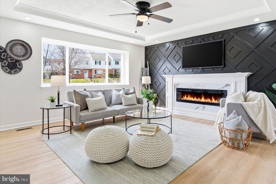 Beautifully renovated 4-bedroom, 2-bath end-of-group townhome filled with tons of natural light. The main and lower levels feature luxury vinyl plank flooring throughout. The living area showcases a stunning accent wall with a gorgeous fireplace, creating a warm and modern focal point.

The updated kitchen offers modern finishes, stainless steel appliances, and granite countertops, perfect for everyday living and entertaining.

The upper level includes three spacious bedrooms and one full bath, with brand-new plush carpet and ceiling fans in every bedroom.

The finished lower level provides additional living space with a large family room, a fourth bedroom, and a full bathroom. You'll also find luxury vinyl plank flooring, recessed lighting, and modern finishes in the bathroom with a large walk-in shower.

Step outside to a flat, fenced-in backyard, ideal for relaxing, entertaining, or pets.

Conveniently located near major commuter routes, local restaurants, and shopping.