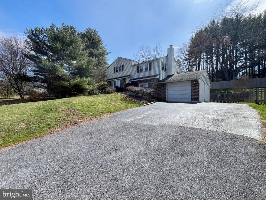 Spacious 4-bedroom split level colonial in West Bradford Township, located in the coveted Downingtown School District with a West Chester address and low taxes. Situated on a picturesque 3/4 acre fenced lot with public sewer and water, this home looks cozy and compact from the exterior, but is much more spacious than it appears! Enter to find a beautiful dining room with gorgeous view from the large bay window (room could also be used as a living room), hardwood floors which open to an updated kitchen with granite counters and a large island with seating overlooking a bright and airy all-season sunroom with wall to wall windows. Lower level has a family room with a fireplace, a full updated bath, plus laundry room with storage and garage entry. Step down to find a pantry, a rec room/playroom, plus a utility/storage area. The upper levels have beautiful hardwood floors throughout. Second level includes two nice size bedrooms and a full bath, leading up to the third level with large master bedroom, above attic storage, plus an additional 4th bedroom. Off the sunroom you ll find a large open deck with private view of the wide-open yard and a retractable awning! A must-see single home with privacy, scenic views, spacious rooms and plenty of storage at a great value! Property sold As Is, Where Is, Buyer will be responsible for any certifications needed.