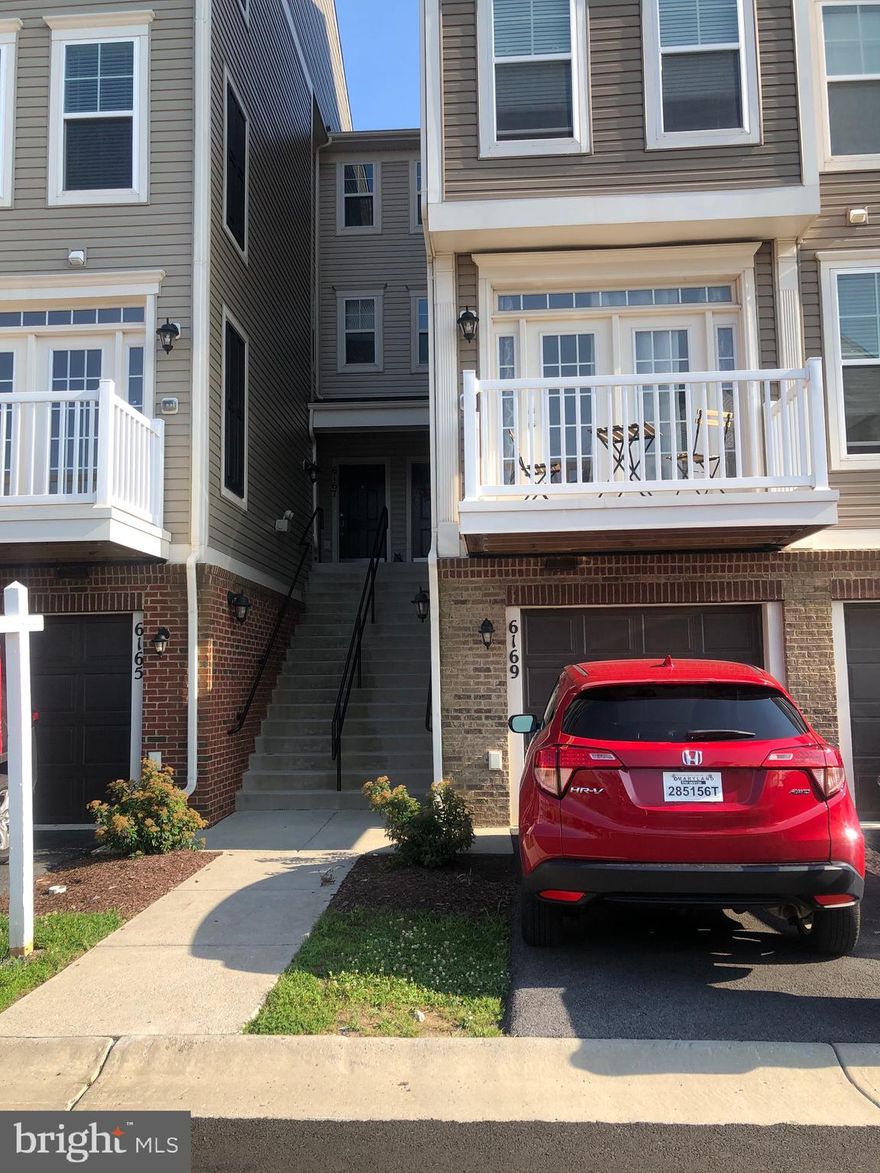 Welcome to maintain free living this lovely 3 bedroom 2 full bathroom 2 half bath and  one car garage condo with an open floor plan - Dining area, Family Room, Walk out Deck, Gourmet Kitchen, Large Center Island, Granite Countertops, Double Sinks, Stainless Steel Appliances, and Gas Cooking. The Upper level features two Bedrooms, full bathroom and  wash and dryer. Top level is the owner's Suite with his and hers  sink separate shower and tube.  The community has much to offer and you are just a few steps away from it all.