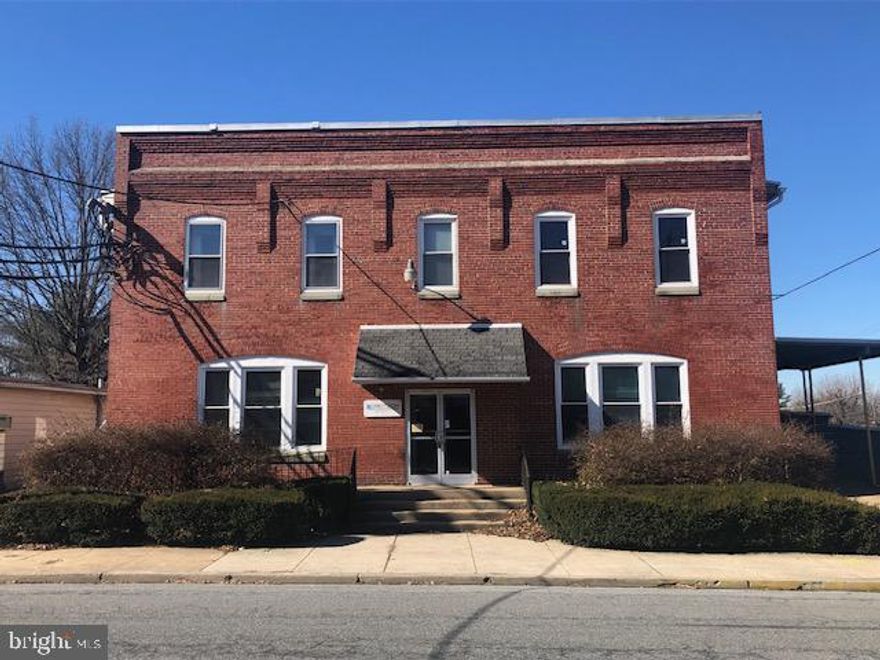 This property also includes a 26 car parking lot across the street. (.22 acre) Tax ID#  57-5318-05-29-3225 should also be listed on your AOS to include the parking lot. Public records lists square feet of the building as <25,000 sq ft. Buyer's agent should verify square feet prior to submitting an offer.  Building has been emptied and has 3 phase electric and loading dock. Property is being sold As-Is. Call listing agent for info on turning on  the lights and further information about the building and it's history.