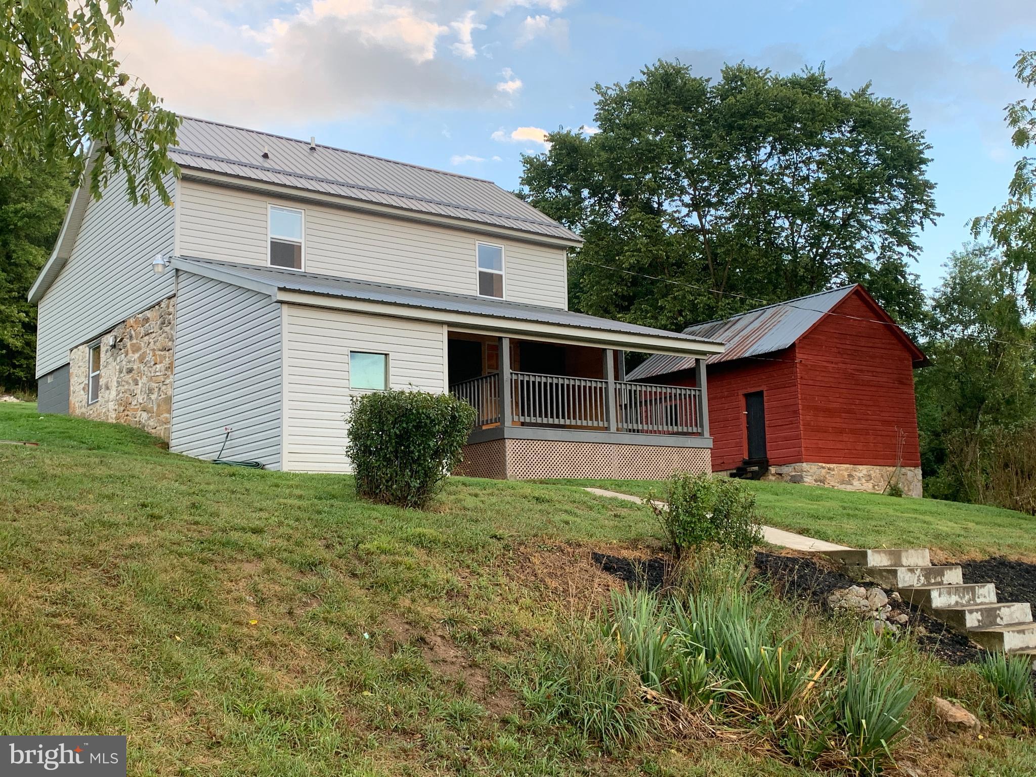 Back on the market after buyer financing fell through. Enjoy peace and serenity in this completely remodeled 1873 log farmhouse. The home keeps its rustic character through the tongue and groove pine walls, barn board ceiling and original red oak exposed logs. This 3.31 acre property also includes a 1,000 square foot, 3 level barn and chicken coop. Situated between Hagerstown and Hancock, the location allows you to enjoy the quiet of the country while still remaining connected to the city. Close proximity to the Western Maryland Rail Trail, C&O Canal and Fort Frederick State Park provides you with endless recreational opportunities. Located just 3 miles from Interstate 70, commute to Hagerstown or Frederick with ease. Don't miss your opportunity to own this one of a kind property!