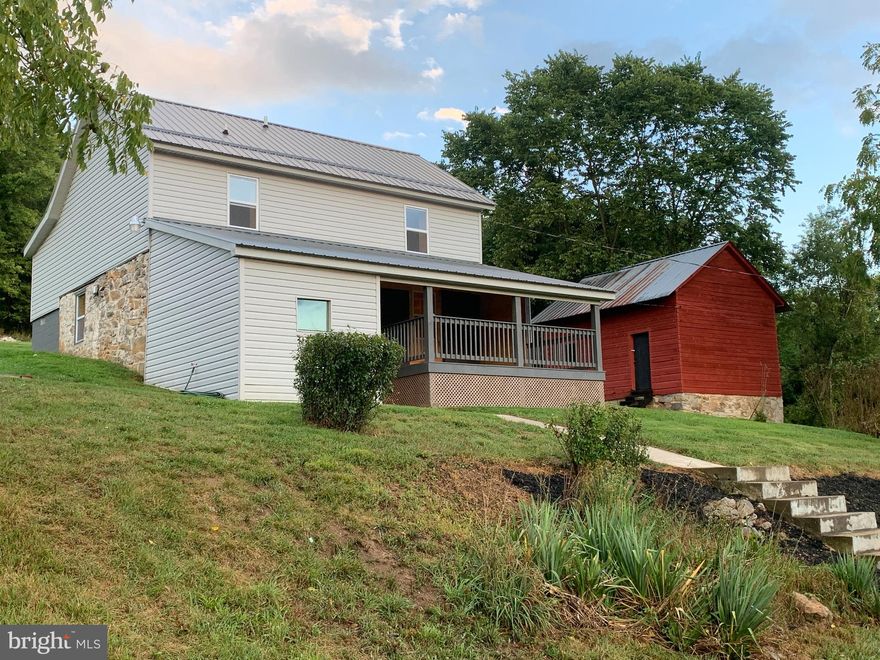 Back on the market after buyer financing fell through.  Enjoy peace and serenity in this completely remodeled 1873 log farmhouse.  The home keeps its rustic character through the tongue and groove pine walls, barn board ceiling and original red oak exposed logs.  This 3.31 acre property also includes a 1,000 square foot, 3 level barn and chicken coop.  Situated between Hagerstown and Hancock, the location allows you to enjoy the quiet of the country while still remaining connected to the city.  Close proximity to the Western Maryland Rail Trail, C&O Canal and Fort Frederick State Park provides you with endless recreational opportunities.  Located just 3 miles from Interstate 70, commute to Hagerstown or Frederick with ease. Don't miss your opportunity to own this one of a kind property!