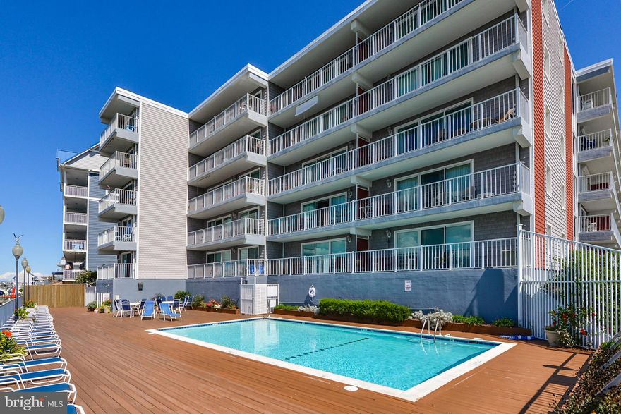 Great rental or second home!  Unbelievably beautiful bay and ocean views from this incredible 2BR/2BA condo. You will love the large balcony for relaxing and watching breathtaking sunrises and sunsets and all the activity on the boardwalk.  There is a large open living area for entertaining family and friends. The dining area is off the living area overlooking the water.  The kitchen will delight the cook in the family with some newer appliances and plenty of storage and counter space. There is an oversize master bedroom with a great master bath. The second bedroom is ideal and there is a second full bath.  Both baths and the floor throughout have been updated. This is a well managed and well maintained building. You will love the location close to restaurants, marinas and the boardwalk, and the condo building has a beautiful pool overlooking the bay. In addition, the unit is being sold fully furnished.  The Owner recently put the unit into the Summer rental program for 2019.  For 2018 this property did over $25k in rentals.  This is a choice property for vacationers because it's convenient and centrally located.  Come take a look today.