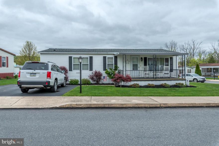 Well maintained double wide home with a bright sunroom and new roof in a 55+ community. 3 bedrooms, 2 full baths with lots of closet space, plus a shed on a large corner lot.