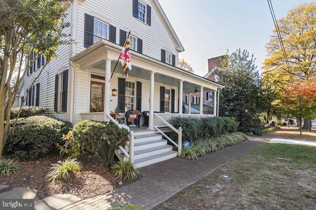 Discover this charming historic home in the heart of St. Michaels, built circa 1890, where classic craftsmanship and timeless elegance come together. Starting with the expansive wrap-around porch, you can see this home is a traditional gem. Highlights of the home include 9ft. ceilings, hardwood floors throughout and original architectural details that define the craftsmanship. and charm. The first floor includes a private bedroom with gas fireplace, formal dining room, formal living room with wood burning fireplace, and large family room off the kitchen which is also open to the living room. Through the back door you descend the steps to a large screened-in porch ideal for entertaining and small dinner parties. The yard is fully fenced and includes a detached studio that is perfect as an office , artist studio or additional guest room, providing both flexibility and privacy. The second floor features a large primary bedroom with sitting room featuring a gas fireplace and built-ins, two additional bedrooms, and full bath. There is also the staircase for walk-up access to the attic. This property also offers off-street parking which is a true added value to any historic St. Michaels home. Being 1/2 block to the harbor and Talbot Street, you are just minutes to all the best St. Michaels has to offer. Professional photos coming soon.