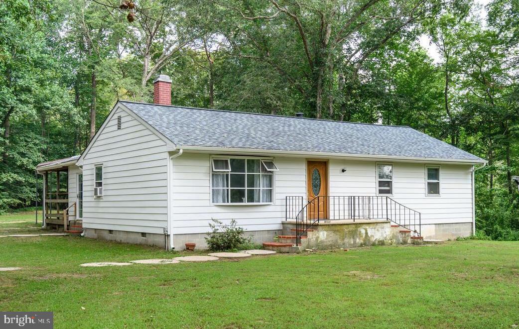 Looking for privacy and seclusion? This 3-bedroom rancher offers just that, nestled on 4.5 +/- acres along a branch of Fowling Mill Creek Pond, where you can launch a canoe and enjoy fishing right from your own property. Surrounded by mature trees and abundant wildlife, including deer and turkey, this property is a true retreat for nature lovers and hunters alike. Inside, the home features a living room with a wood stove, a spacious kitchen with a dining area offering plenty of room for a dining table and a separate laundry room. The sunroom at the rear of the home opens to an expansive covered deck overlooking the backyard, the perfect spot to relax and take in the peaceful setting. Recent updates include a new roof and gutters. A large detached garage, formerly used as a sign shop, offers a tall overhead door and provides an ideal space for a workshop, storing outdoor toys or even accommodating a home-based business. An old horse stable on the property offers additional potential for restoration and repurposing. If you’ve been dreaming of a private haven with direct access to the outdoors, this property is ready to welcome you home.
