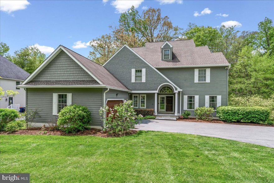 This fine home is the one you've been waiting for!  Located just outside of vibrant Kennett Square, 121 Hadleys Mill Run is a fantastic 4 Bedroom, 3.2 Bath Colonial in Unionville Chadds Ford School District! The home is situated in the cul-de-sac neighborhood of Hadleys Mill, backs to open space and is a stones through away from Kennett Square Golf & Country Club. The handsome curb appeal of this home showcases the classic Hardie siding and turned garage with wood-look door.  Step inside from the covered front porch, and be greeted by a spacious and sunlit foyer with expansive hardwood floors and tasteful décor. You'll immediately notice the attention to detail with the paneled, turned staircase and arched doorways.  To the right, the expansive foyer opens to the Living Room with ample trimwork and oversized windows. Foyer also opens to the formal dining room with a continuation of upscale finishes.  Ahead is the generously sized family room with (natural gas) fireplace and open to the Kitchen.  The gleaming kitchen offers an expansive concrete-top island, custom backsplash, and roomy dining area.  This floorplan was made for entertaining as Kitchen sliders provide seemless access to rear composite deck and private views of the wooded backdrop.  Back inside, the first floor is rounded out by a large Laundry Room, nearby Powder Room, and a continuation of hardwood floors, attractive trimwork, and large windows. 
Upstairs there are 4 large bedrooms, including the generously sized Primary Bedroom with large en-suite bath and large en-suite Dressing Room (complete with the included 'island'.  Primary bath includes oversized shower stall, separate soaking tub, and double vanity. The three additional bedrooms are all generously sized and are served by two additional baths.  One benefit of the 4th bedrooms is the adjacent loft/ bonus room which easily serve as an in-law suite or aupair suite. Downstairs the finished, walk-out  basement (complete with an additional powder room) offers flexibility for use as you see fit.  Additionally, the current owners utilized one portion of the basement for an excercise area without foregoing plenty of storage space in the remaining unfinished portion of the basement.  Finally, if the view from the Deck, wasn't enough, you'll find your own private oasis in the lower level screened porch with porch swing!  Relax the evening away in this special space. The gently sloping yard  provides complete privacy with mature trees and adjacent open space.   Top it off with a gas-fired back up generator!  Other notable features include the near new  HVAC systems (2023 and 2024), newer roof (2018), and Public Water/Sewer! Schedule your tour today!