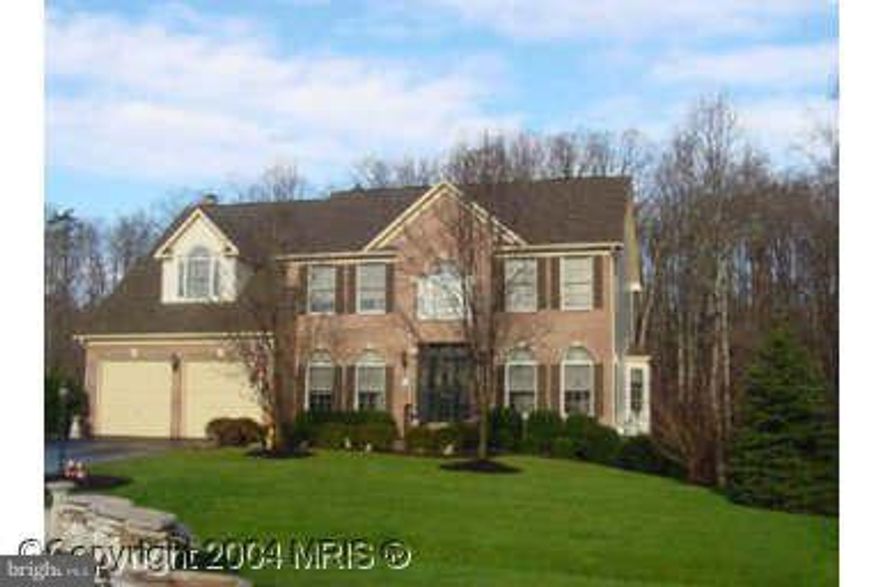 Privacy, woods and a stream on this special lot.  Custom colonial with double garage and lots of parking.  Home has custom features, two fireplaces, hardwood floors.  Great for entertaining, custom bar and large room for dancing.  Large flagstone patio for grilling, very nice!