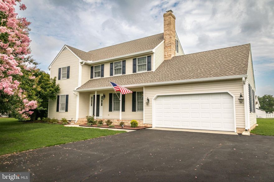 This gorgeous home located in the Cross Creek community is exactly what you've been searching for! Beautiful mature trees and landscaping frame this 4 bedroom, 2.5 bath Colonial sitting on over half an acre. This home has been well cared for during it's ownership, it has received a new roof in 2024 along with new six inch guttering. The septic was pre-inspected by Blue Wave Environmental and minor repairs were made, as well as the crawlspace is encapsulated with a dehumidifier.  A large paved driveway and attached 2 car garage give ample parking room for both guests and owners. The backyard features a composite deck, perfect for relaxing while overlooking the spacious property. Just off the deck is a beautiful patio area with a fire pit for enjoying those chilly Fall evenings coming up. Entering the home, you'll find a tiled foyer with stairs leading to the second level, and a family room just off the kitchen with a gas fireplace and built-in cabinets for extra storage. The higher-end kitchen presents quartz countertops, tile flooring, a commercial range for the culinary connoisseur, and plentiful storage opportunities. The dining area has sliding glass doors that lead out to the deck for easy entertaining. Adjoining the dining area is a spacious living room waiting for your finishing touches and decor. Upstairs is an en-suite primary bedroom with two closets. Both full bathrooms on the second floor feature beautiful custom cabinetry and quartz countertops. There are also 3 other bedrooms located on the second level. Your search can end here at 27976 Cross Creek Dr. Make your appointment to tour this home today!