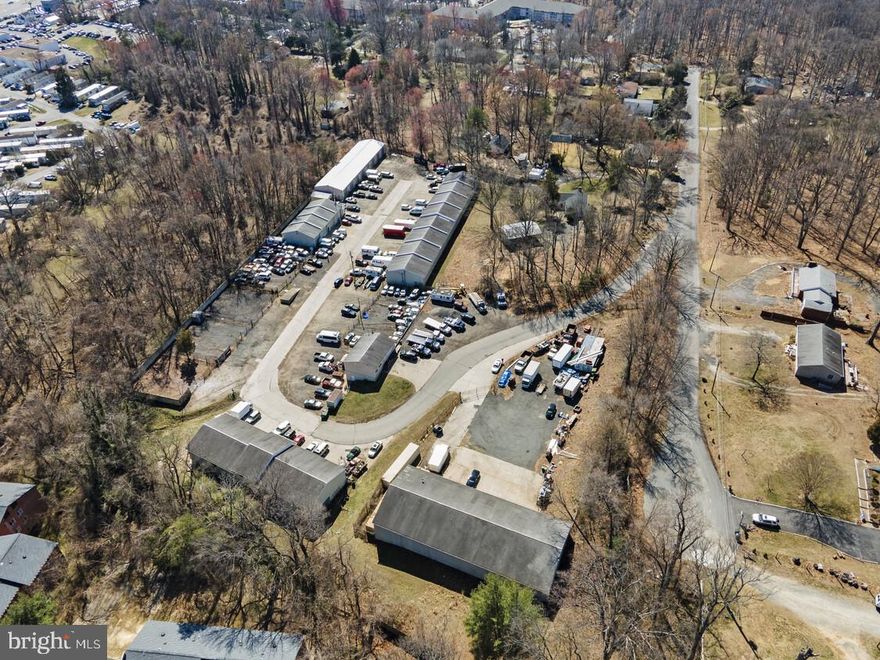 Rare M-2 Zoned Industrial Property in Prince William County-The Sale Includes: 14341, 14351, and 14381 Pine Land for a total of 6.79 Acres Zoned M-2.
An exceptional opportunity awaits in Canfield Industrial Park—offering rare M-2 Light Industrial Zoning in sought-after Prince William County. This versatile property presents a powerful combination of immediate cash flow potential and long-term redevelopment upside, making it ideal for investors, developers, or owner-users looking to secure a footprint in one of Northern Virginia’s fastest-growing regions. Multiple Tenants on 30 days net leases and Long Term Continuation of Non-Conforming Use.
Property Highlights:
Zoning: M-2 (Light Industrial) – a rare and flexible zoning designation in the county
Site: Multiple buildings, outdoor storage areas, and fenced lots on a large industrial parcel
Buildings:
One Building – divided into bays
One Building with 22 Bays with estimated 800 sqft each – Designed for a variety of industrial or service uses
Outdoor Storage:
48,418 SF Outdoor Storage Yard
47,816 SF Outdoor Storage Yard
(7) Separate Fenced Lots – Great for equipment, vehicle, or container storage
Investment Potential:
Cash Flow Ready – Existing structures and yard spaces are ideal for generating income through leases to contractors, service providers, storage tenants, or other industrial users.
Flexible Use Case – Perfect for outside storage, construction yards, logistics, auto/truck services, and more. The M-2 zoning supports a wide range of industrial applications.
Redevelopment Opportunity – Given its size and location, this property offers long-term potential to redevelop into Class A industrial, modern flex space, or even residential redevelopment, pending appropriate approvals.
Location Benefits:
Situated in Canfield Industrial Park, a well-known industrial area with proximity to major transportation corridors.
Easy access to Route 1, I-95, and regional commercial hubs.
Positioned in a high-demand corridor where industrial space is scarce and land is increasingly valuable.