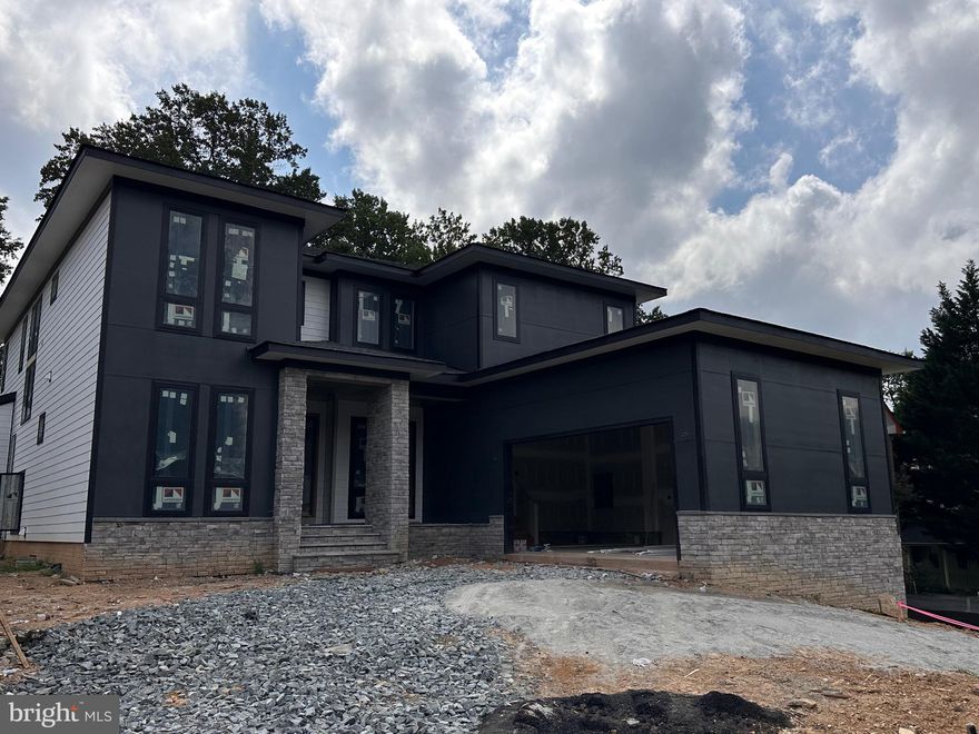 95% of the construction is completed!  Exceptional new construction on a one-third acre lot inside the Beltway! This stunning residence at 4017 Woodland Dr offers over 6,300+ sqft of luxury living across three beautifully finished levels. The main floor showcases 10’ ceilings, a spacious great room with tray ceiling, a chef’s kitchen with butler’s pantry, a dedicated study/bedroom, and a mudroom with built-in dog wash. The upper level features a grand primary suite with a spa-style bath, plus four generously sized bedrooms, each with walk-in closets and direct bath access. The fully finished walkout basement includes a media room, game area, gym, wet bar, and two full baths—ideal for entertaining and everyday living.

Located on a quiet corner just minutes from popular plazas, dining, and commuter routes.
Bonus: The adjacent home at 4015 Woodland Dr—identical in layout and finishes—is also available! Perfect for extended family or investment.