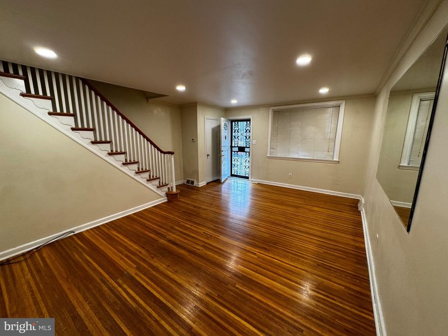 Welcome Home! Modernized 3-bedroom town home located in the vibrant East Mount Airy neighborhood. Enjoy the convenience of nearby restaurants, shops, and easy access to trains, transportation, and bike trails. Step inside to be greeted by stunning natural hardwood floors that flow seamlessly into your modern, contemporary kitchen. The kitchen features sleek soft white cabinets with matching quartz countertops, new stainless steel appliances, and new ceramic tile flooring. Enjoy a finished basement any way you prefer for extra living space and convenience, with a laundry utility area, no need to walk outside because it leads to a full garage with remote garage door opener. Then relax and unwind on your newly constructed rear patio outdoor retreat area. Upstairs, you'll find three bedrooms, a modernized hall bath, linen closet and new ceiling fans throughout. Off-street parking and a private driveway. New Central Air Condenser May 2025. Don't miss the opportunity schedule your tour today!