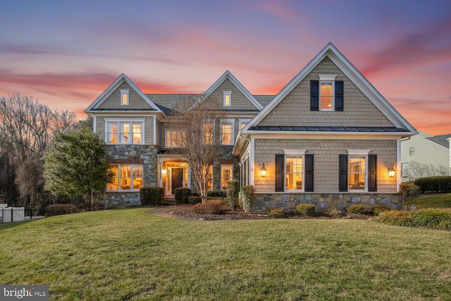 Stunning single-family home on a premium .46-acre lot backing to a Great Seneca Creek Park, offering privacy and scenic views. Enjoy over 6,700 square feet of living space across three finished levels, featuring 4 bedrooms, 4.5 bathrooms, and an attached 2-car garage.

A grand two-story foyer welcomes you with gleaming hardwood floors throughout, flanked by elegant formal living and dining rooms. The main-level private office/study showcases built-in shelving and a wet bar, all overlooking the backyard. The expansive family room features a striking dual-sided wood-burning fireplace and wall-to-wall windows letting in tons of natural light. Adjacent is a bright eat-in area with direct access to the expansive deck that's perfect for entertaining and complete with sweeping treelined views and a spiral staircase leading to the lower-level patio.

The gourmet kitchen boasts custom cabinetry, top-of-the-line stainless steel appliances including a 6-burner gas cooktop and double wall ovens, granite countertops, warming drawer, and a large center island with breakfast bar seating. The main level is completed by a powder room and a mudroom with built-in storage.

Upstairs, the luxurious primary suite impresses with double-door entry, a vaulted ceiling, and a wood-burning fireplace. A private sitting room with wet bar and Juliet balcony overlooks the foyer. The spa-inspired primary ensuite bath includes a soaking tub, walk-in shower, dual vanities, and a generous walk-in closet. Three additional bedrooms are well appointed, including two sharing a Jack-and-Jill bath and a junior suite with its own ensuite bathroom, plus a convenient upper-level laundry room.

The fully finished lower level offers a vast recreation room with a full bar and wall-to-wall windows opening to a brick patio with an outdoor wood-burning fireplace that's ideal for year-round gatherings.

Prime location combining privacy with close proximity to shops, restaurants, schools, and parks, this exceptional home is a must see! Schedule your showing today.