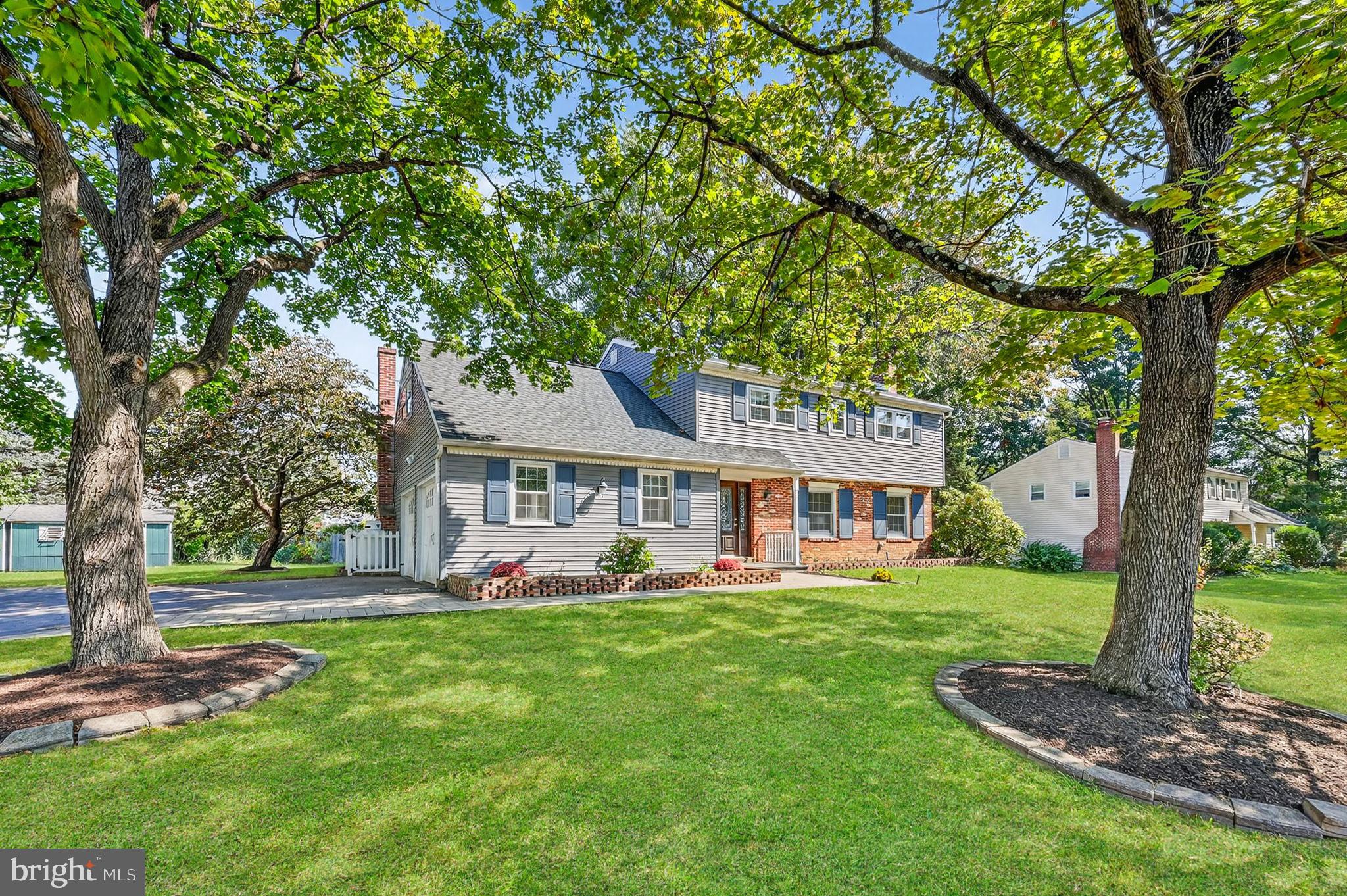 Welcome to 202 Garnet Lane – A Beautiful Colonial in a Sought-After Neighborhood. Nestled in a serene and family-friendly community within the award-winning Wallingford-Swarthmore School District, this spacious 5-bedroom, 2.5-bathroom colonial offers comfort, charm, and room to grow. Step through the elegant leaded glass front door into a welcoming foyer with a convenient coat closet. To your right, the inviting formal living room features a wood-burning fireplace with a granite surround and classic dentil molding mantel—perfect for cozy evenings or entertaining guests. The living room flows seamlessly into the formal dining room, which is enhanced by pocket doors that lead to a bright eat-in kitchen. The kitchen is outfitted with stainless steel appliances, granite countertops, and a matching granite backsplash—both stylish and functional. Just off the kitchen is a stunning, sun-drenched family room. With a wall of windows, two skylights, and a stacked-stone gas fireplace with a chunky wood mantle, this expansive space is ideal for gathering, relaxing, or simply enjoying the natural light. A spacious two-car garage offers ample storage and direct access to the kitchen. A convenient powder room completes the first floor.
Upstairs, you'll find three generously sized bedrooms and a full hall bath, along with a spacious primary suite that includes a private ensuite updated bathroom with radiant heat floors. A fifth bedroom, located on the opposite side of the staircase, features additional storage and versatile space—perfect for a home office, guest room, or playroom. The large basement provides excellent storage and holds exciting potential for finishing as a rec room, gym, or media space. The laundry area, complete with washer, dryer, and utility sink, is also located here. Don’t miss the opportunity to make this warm and welcoming home your own in one of the area's most desirable neighborhoods.