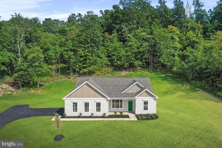 MOVE IN READY! NEW PRICE! Nearly 3 acre lot with amazing views. 3 bedroom, 2 full bath one level home with split floorplan that is perfect for both entertaining and relaxing. Oversized side load garage. Over 1500 sq ft all on one level. Enjoy the views and wildlife from the custom covered patio at the rear of the home.