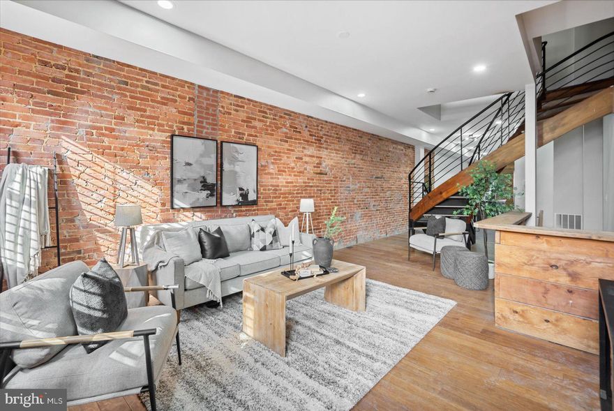 Fully permitted renovation on fantastic block, tons of renovations going on! As you walk into the open floor with bamboo floors you'll be greeted with a custom open spiral staircase. With exposed wood front and rear wall as well as covering the basement stair knee wall, this property has incredible style. In the rear, the kitchen features two tone blue and white cabinets with granite on top, next to the main floor half bath. 

Up the spiral stairs you find yourself in an open hallway with custom glass and drywall knee wall as well as two bathrooms and 2 bedrooms. On the top floor you'll also be greeted with two bedrooms and one bathroom. The basement is clean and unfinished, set for plenty of storage. 

With easy access to Penn Station, 83 and Greenmount Avenue you'll love growing with the block. Multiple renovations recently completed and still ongoing on the block! 

Property has replaced joists, new 200 amp service and most of framing and electrical finished. The spiral staircase is a cool common element to this property. The back yard also has potential to add parking pad, or keep as enclosed rear yard. 2nd and 3rd floor have lots of flexibility in design. Roof is new rubber torch down. basement is 6 foot tall, and great for storage and mechanicals. Comps 350k+!