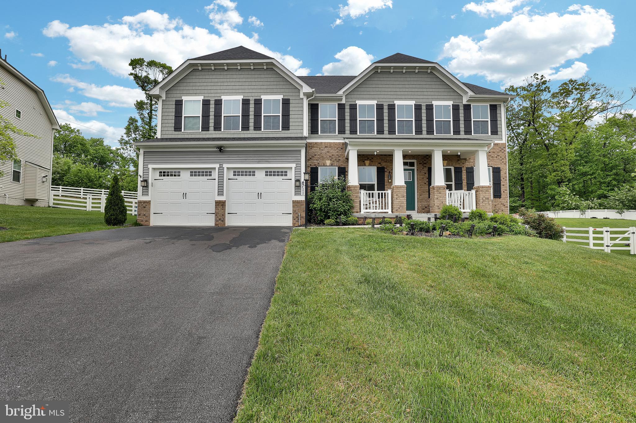 ***OFFER DEADLINE - Monday May 13th 9 AM*** This 2021 constructed NV Homes Versailles model, fully upgraded, exemplifies refined luxury and sophistication with a design that seamlessly marries elegance and contemporary functionality. The grand foyer, framed by arched entryways and highlighted by crown and chair rail molding, establishes the atmosphere as guests are welcomed into a bright, open living space. To the right lies the formal living area embraced with crown molding, while to the left is the dining area adorned with custom wainscoting and crown molding.
The main level is enhanced by premium LVP flooring throughout. The gourmet kitchen serves as the centerpiece, ideal for the culinary enthusiast. It boasts upgraded quartz countertops, an expansive island with seating, high-end stainless steel appliances, custom 42” cabinetry with ample storage, and a meticulously designed tile backsplash that infuses a touch of artistry. Just behind the kitchen is a butler's pantry equipped with electrical outlets for appliances, leading into a substantial walk-in pantry. Additional features include a half bath, a mud area, and access to a two-car garage offering substantial storage.
Adjacent to the kitchen is a breakfast area that opens into a spacious family room, perfect for intimate gatherings or relaxed lounging, enhanced by a serving butler's pantry ideal for entertaining.
The main level also provides ground-floor bedrooms with options for both shared and ensuite bathrooms. The two-story great room features a stone hearth and custom molding along the wall, complemented by a private entry leading to an outdoor seating area and a deck constructed from high-quality TRX panels.
The expansive owner's suite upstairs includes a custom white oak TV wall design, spacious dual walk-in closets, a cozy sitting area, and a spa-inspired ensuite bath with a frameless glass shower and dual quartz vanities. The additional three generously sized secondary bedrooms each feature upgraded walk-in closets and are accompanied by two full bathrooms. A spacious loft and walk-in laundry room with a sink and custom 42” cabinetry complete the upper level.
The lower level provides a versatile recreation area, ideal for a home theater or gaming room, along with a well-appointed wet bar rough-in and an additional guest suite with a full bath. A massive unfinished space accommodates a 2021 HVAC system, tankless water heater, and sump pump.
The double decks lead to a beautifully landscaped yard backed by private trees, offering an idyllic setting for outdoor dining and entertainment.
Smart home features and energy-efficient systems are seamlessly integrated, enhancing convenience while maintaining the opulence of the estate, which, fully upgraded, represents upscale living for those seeking luxury and comfort.