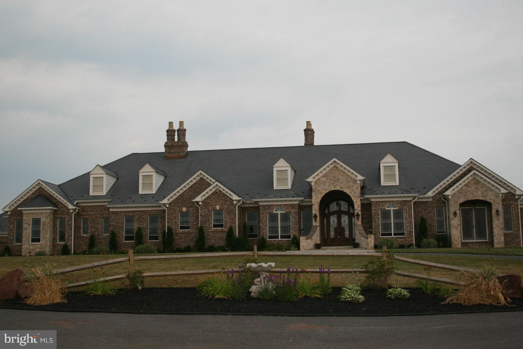 Amazing 8000+Luxury Manor sits on over 52 Acres and features state-of-the-art amenities. A chef's kitchen with cherry cabinets and professional style appliances. Spectacular Owner's suite will surely please the most discerning buyer. Six Fireplaces,Marble Foyer, Huge Basement w/ full Bar, Theater Rm, gym, Sauna, Radiant Floor Heat, 7 car Garage, *** SUB-DIVIDABLE ***
