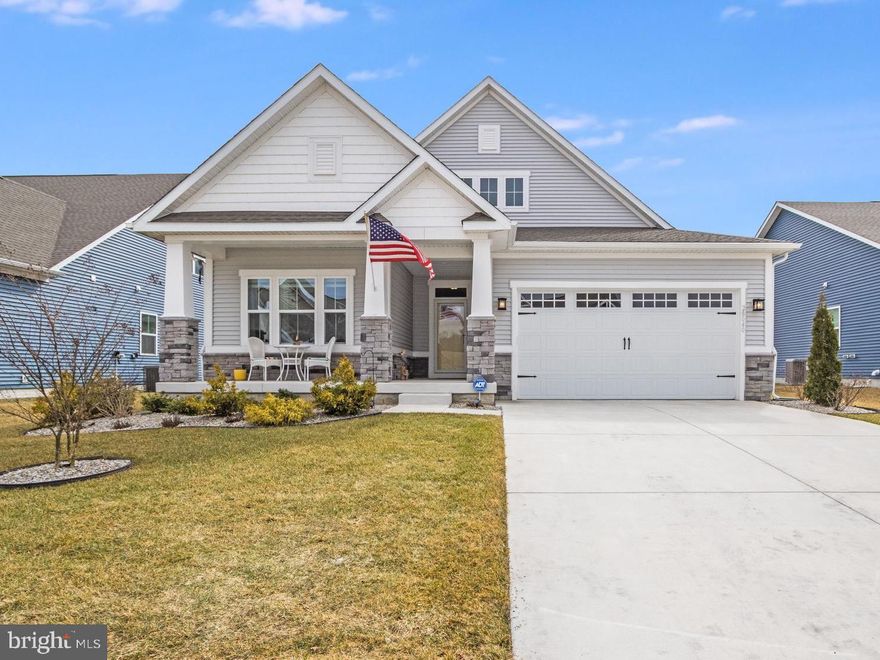 Don’t wait to enjoy coastal living at 28040 Celestial Way in Lewes, DE. Located in the popular community of Anchors Run, this home offers the chance to enjoy a like-new property in a sought-after neighborhood without the wait for new construction. Built in November 2023, this spacious open-concept ranch features 3 bedrooms, 3 bathrooms, and a full finished basement. From the moment you arrive, the upscale exterior makes an impression with beautifully designed coastal landscaping and a backyard created for true relaxation.

The backyard is especially inviting, with a covered porch and a step-down patio added in 2025, featuring a fire pit and seating area. Professionally curated plantings, stone edging, and a timed landscape lighting system create a beautiful setting both day and night, making it a perfect space for entertaining or unwinding at home.

Inside, the home is filled with thoughtful upgrades, including a customized coffered ceiling in the living room, upgraded LVP flooring throughout the main living areas, and 9-foot ceilings that enhance the open and airy feel. The builder’s largest kitchen layout offers impressive functionality, with an expansive 4-seat island, abundant cabinetry, and a dedicated dining area that is perfect for everyday meals and easy living.

The primary suite offers a luxurious retreat with a walk-in closet and an en suite bathroom featuring a large Roman shower and double vanities. The full finished basement adds exceptional flexibility, offering plenty of space for a recreation room, home gym, media room, guest overflow area, or additional storage.

Natural light fills the open floor plan, while the living room takes in peaceful pond views with two fountains. Backing to the pond, the setting is ideal for enjoying morning coffee on the porch or relaxing by the fire pit in the evening. The property also features a well-fed irrigation system to help maintain a lush, green yard while keeping utility costs lower.

Low HOA dues add even more value, with community amenities that include a clubhouse, a large outdoor pool, a fitness center, a full kitchen with an adjacent party and meeting room, walking paths throughout the community, and pickleball courts coming in summer 2026. Lawn care and snow removal are also included.

Located just 5 miles from the beaches and a short drive to downtown Lewes, the Rehoboth Beach Boardwalk, Bethany Beach, and local shopping and dining, this home offers the convenience and lifestyle that make Coastal Delaware so appealing.

Schedule your showing today and experience everything this beautiful home has to offer in person!